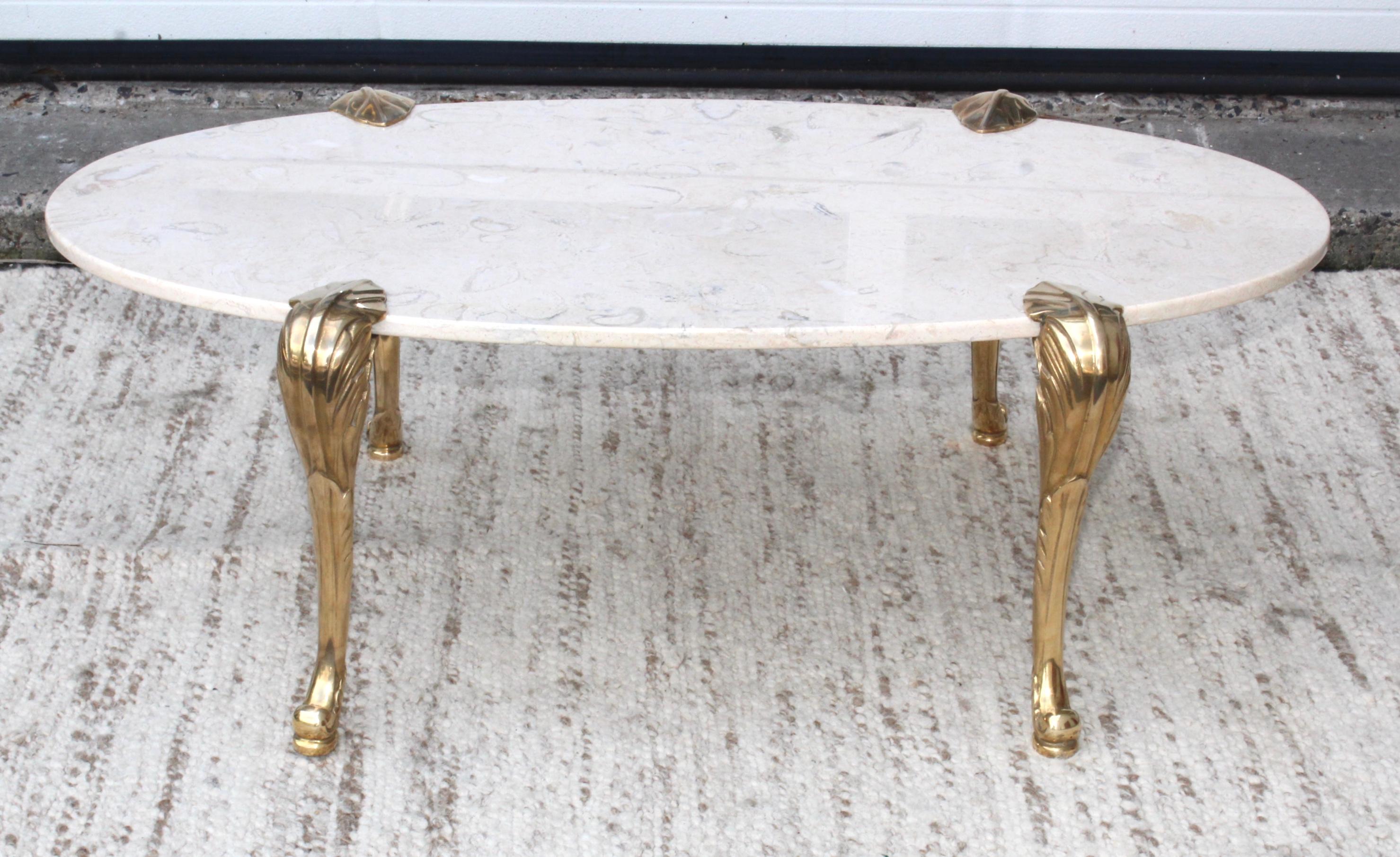 1970s brass legs with oval marble top coffee table attributed to Chapman.