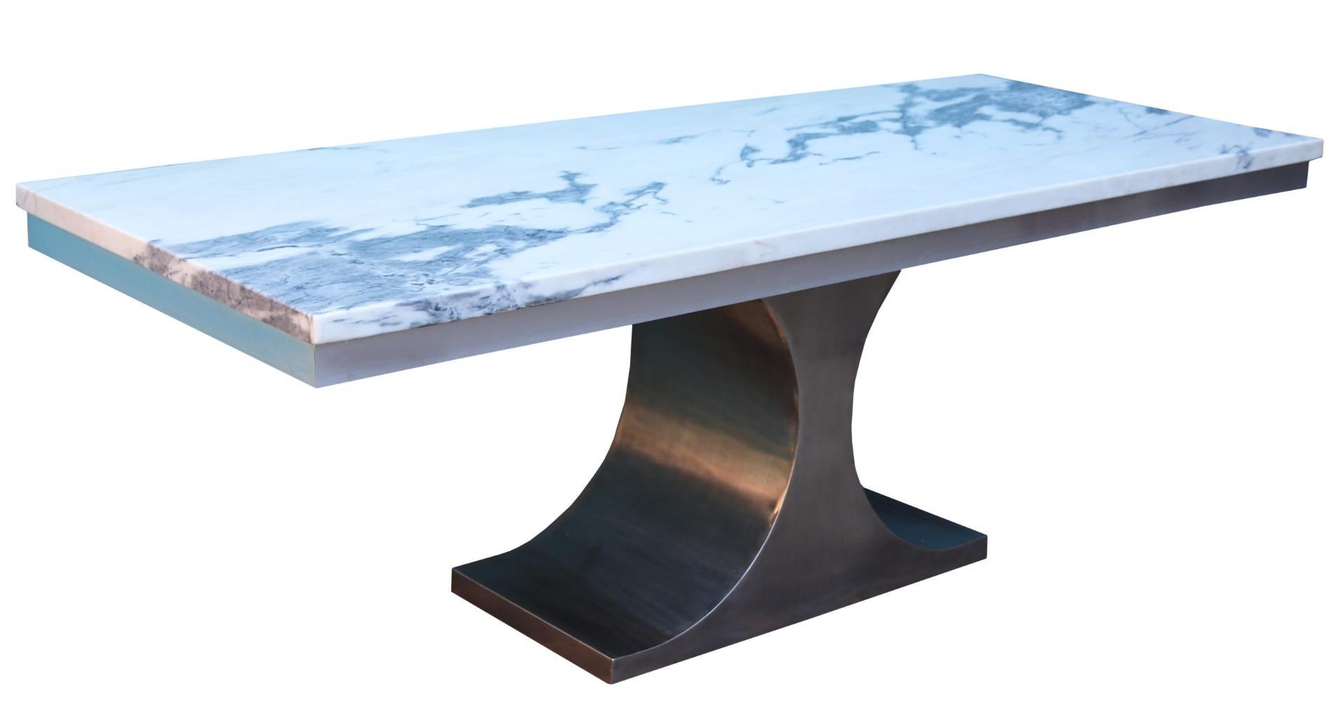 A 1970s dining table. The shaped steel frame clad in stainless steel, with an aluminium perimeter, supporting a single slab of thick Carrara marble.

Additional dimensions:

Height to the table underside 69.5 cm.
