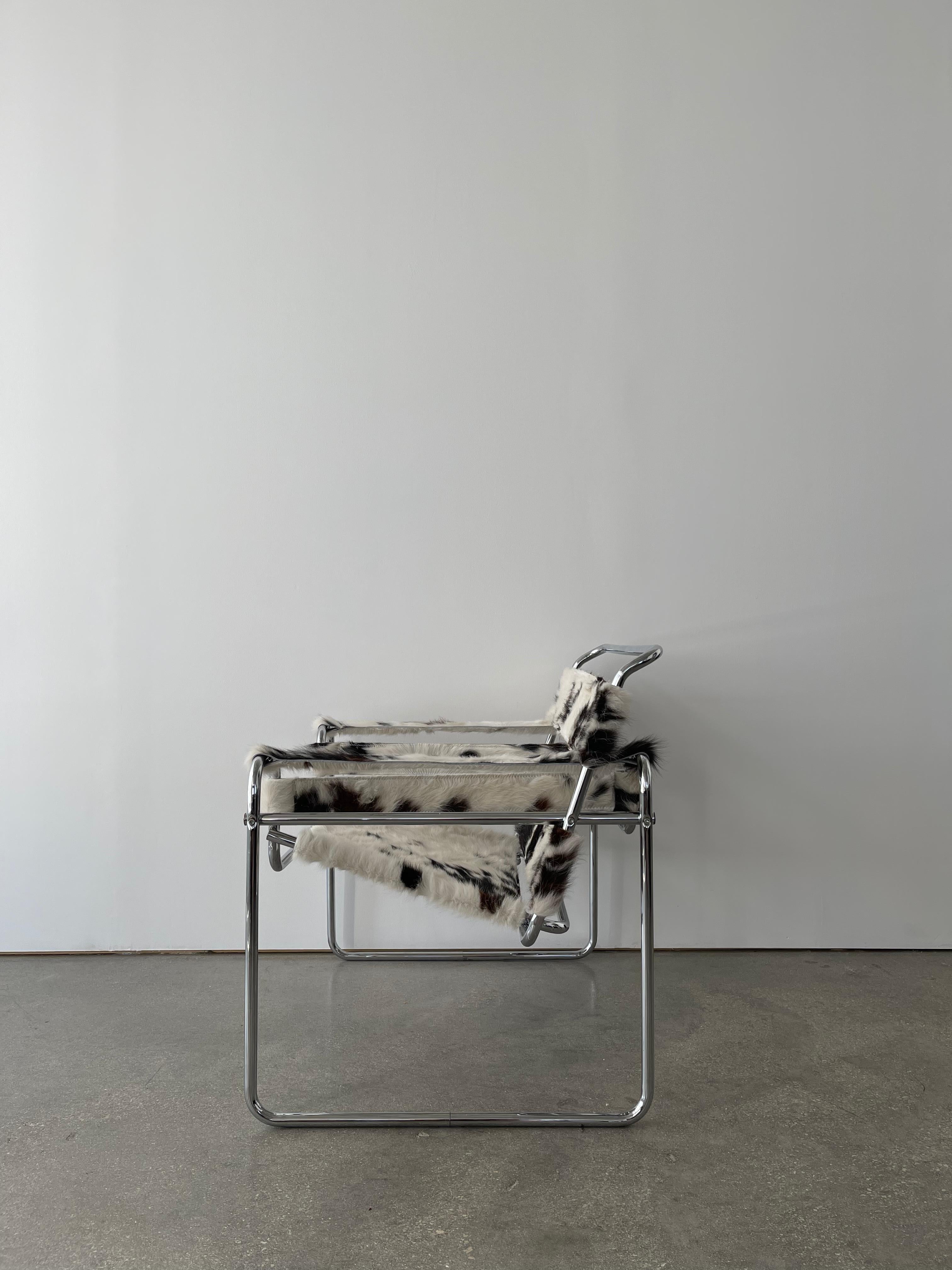 The 1970's Marcel Breuer Wassily 'Style' Armchair was reimagined in thick hairy Texas cowhide. 
The chair is great vintage condition with minimal wear to the chrome frame. The frame is sturdy and strong with thick, tight straps yet light and sleek.