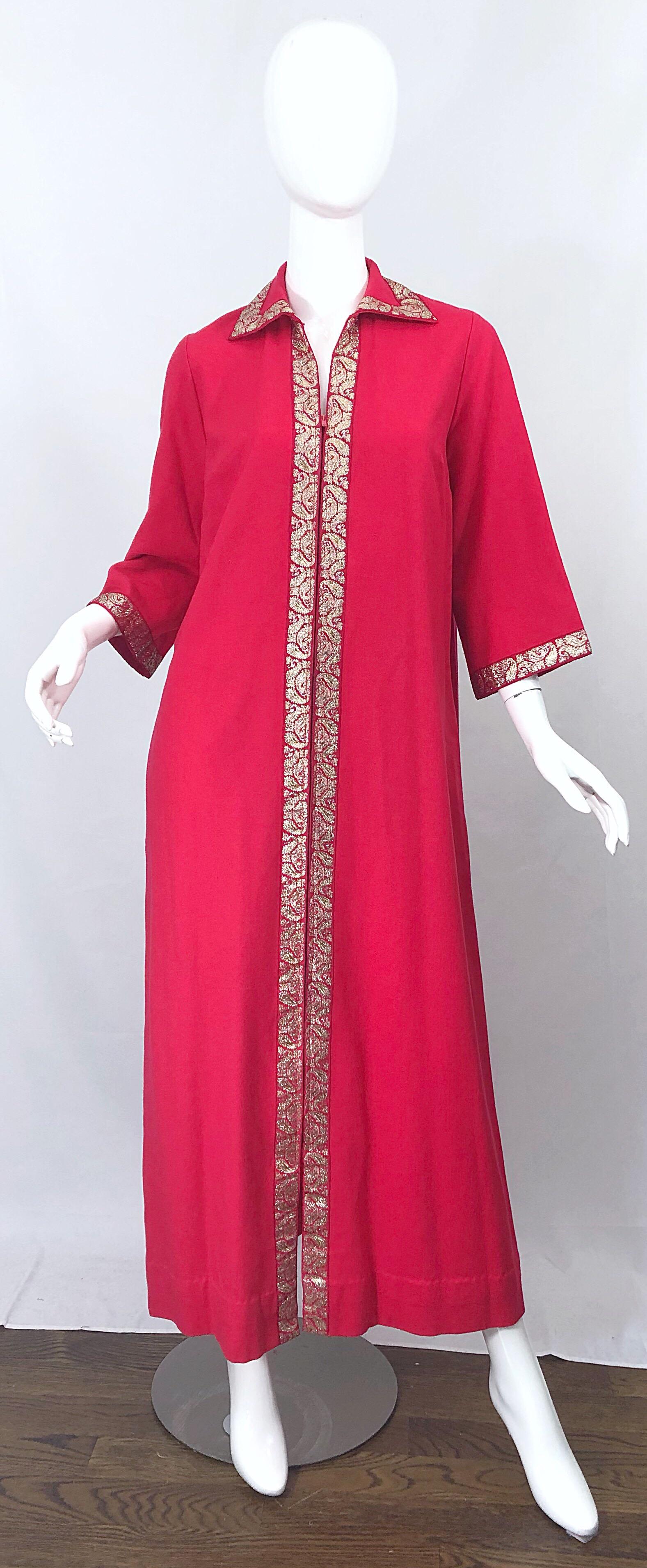 Awesome vintage early 70s MARSHALL FIELDS raspberry pink and gold 3/4 bell sleeve caftan maxi dress! Features gold brocade trim. Zipper up the front with hook-and-eye closure. POCKETS at each side of the hips. In great condition. Made in