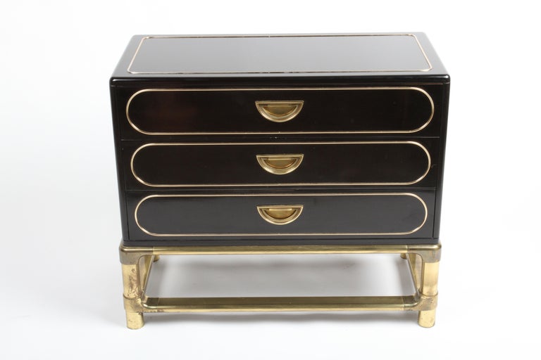 Hollywood Regency 1970s Mastercraft black lacquered chest, dresser or large nightstand with brass base, handles and trim. Original black lacquer has some minor scuffs, and a few minor nicks, the brass show patina. some minor stains on the inside of