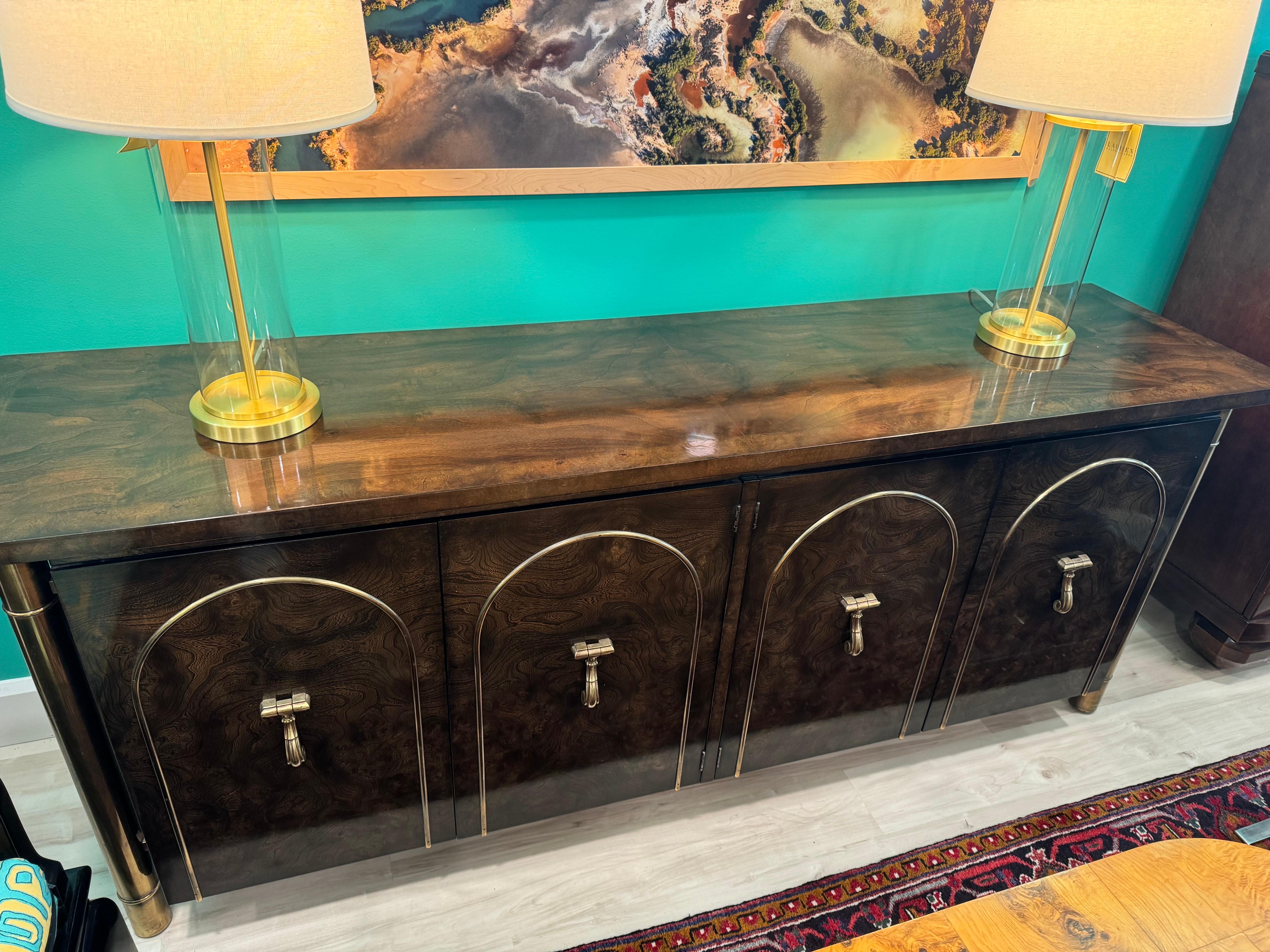 Spectacular Original Example of this Stately piece from Mastercraft. Massive Brass Columns flank the corners and the cabinet appears to float within the structure. 