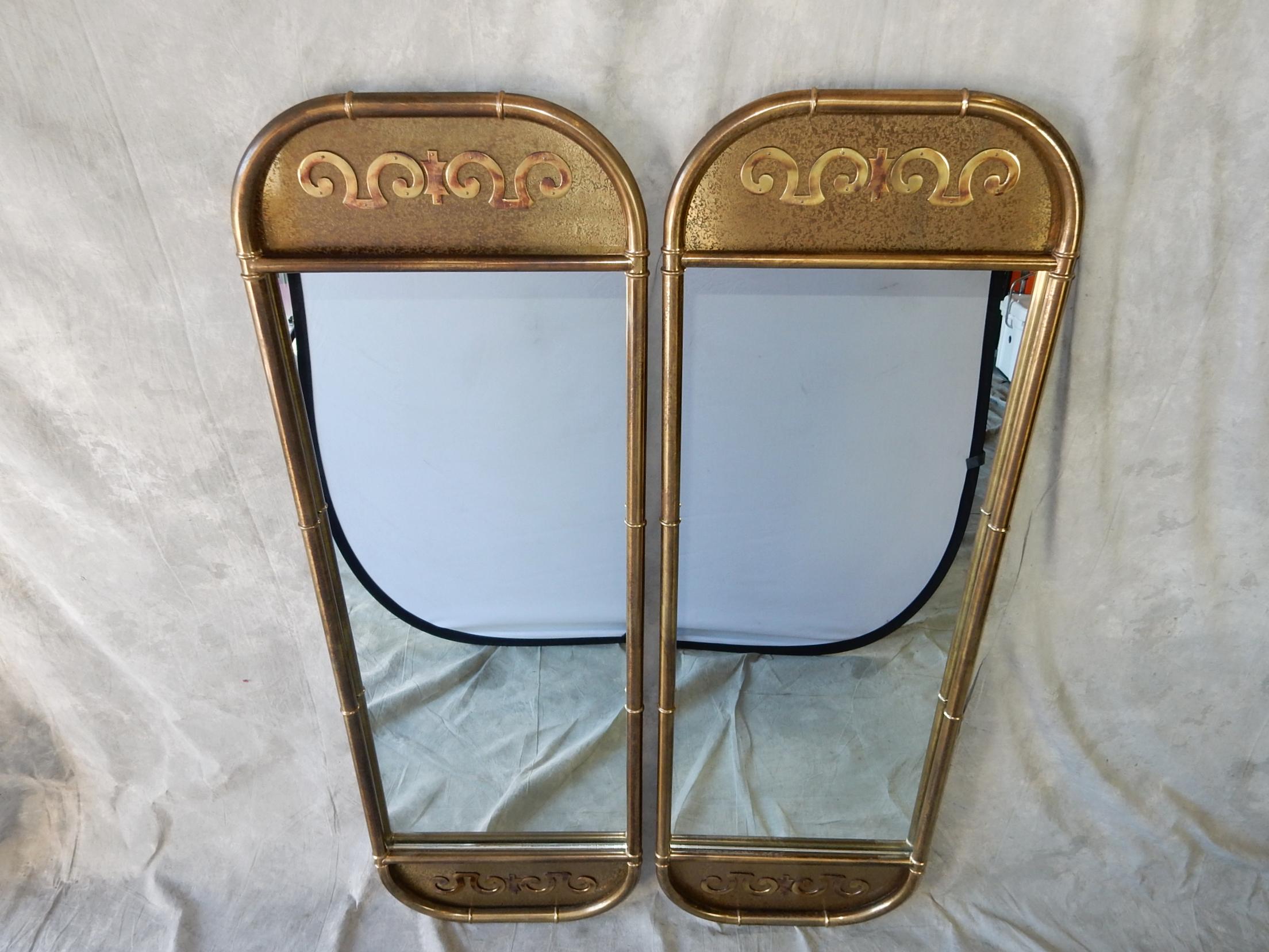 Lovely pair of tall faux bamboo brass wall mirrors by Mastercraft Furniture.
Both are identical and fabulous. Scrolling relief on both top and bottom.. 
They hang individually on picture wire. Can be used separate or together.