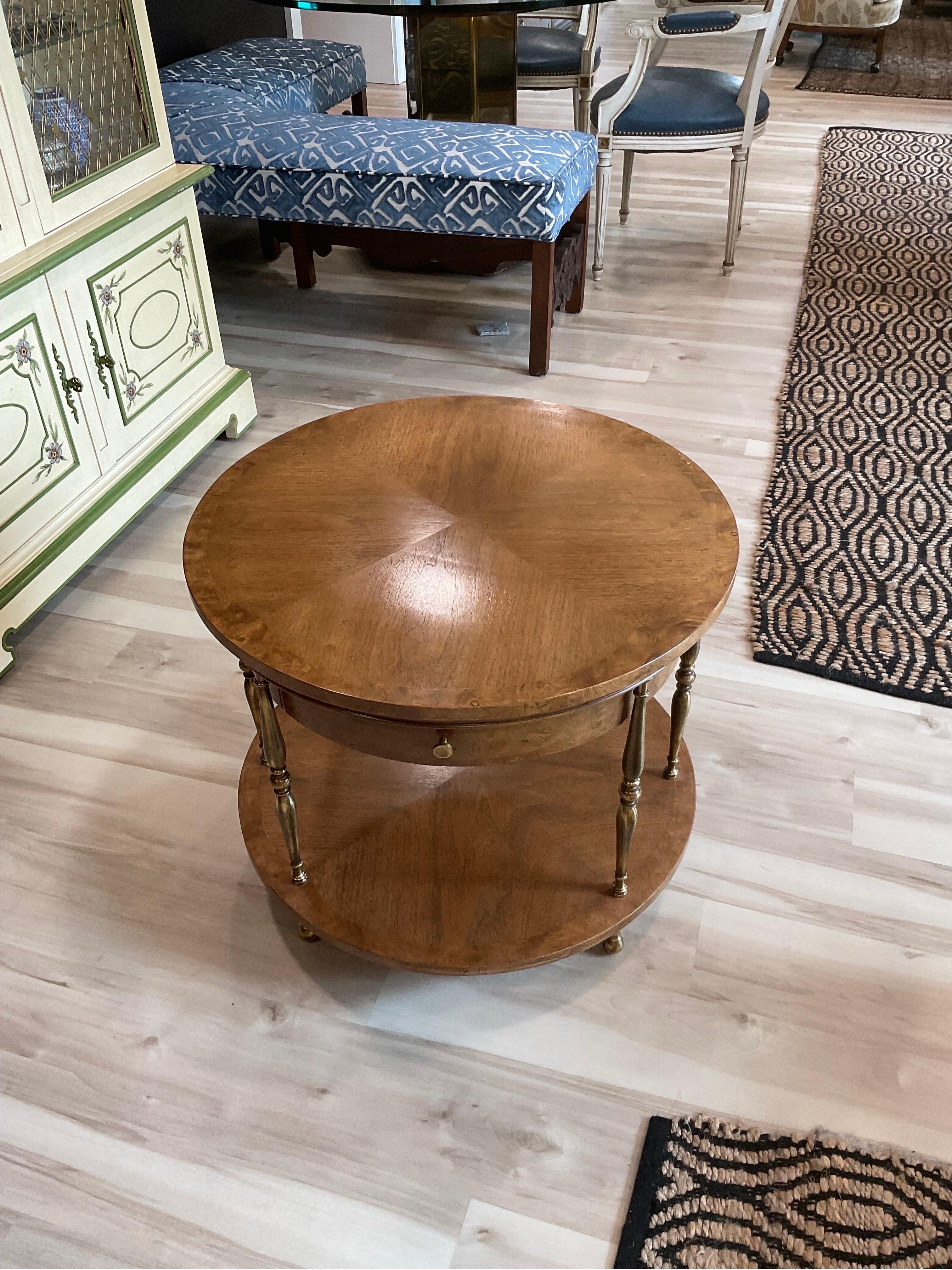 Rare Mastercraft side table in great condition. Round top of Burled wood, signature Mastercraft brass supports separate top and bottom surfaces and one single drawer in the center. Beautiful table. Custom Glass top.

Condition Disclosure:
Please