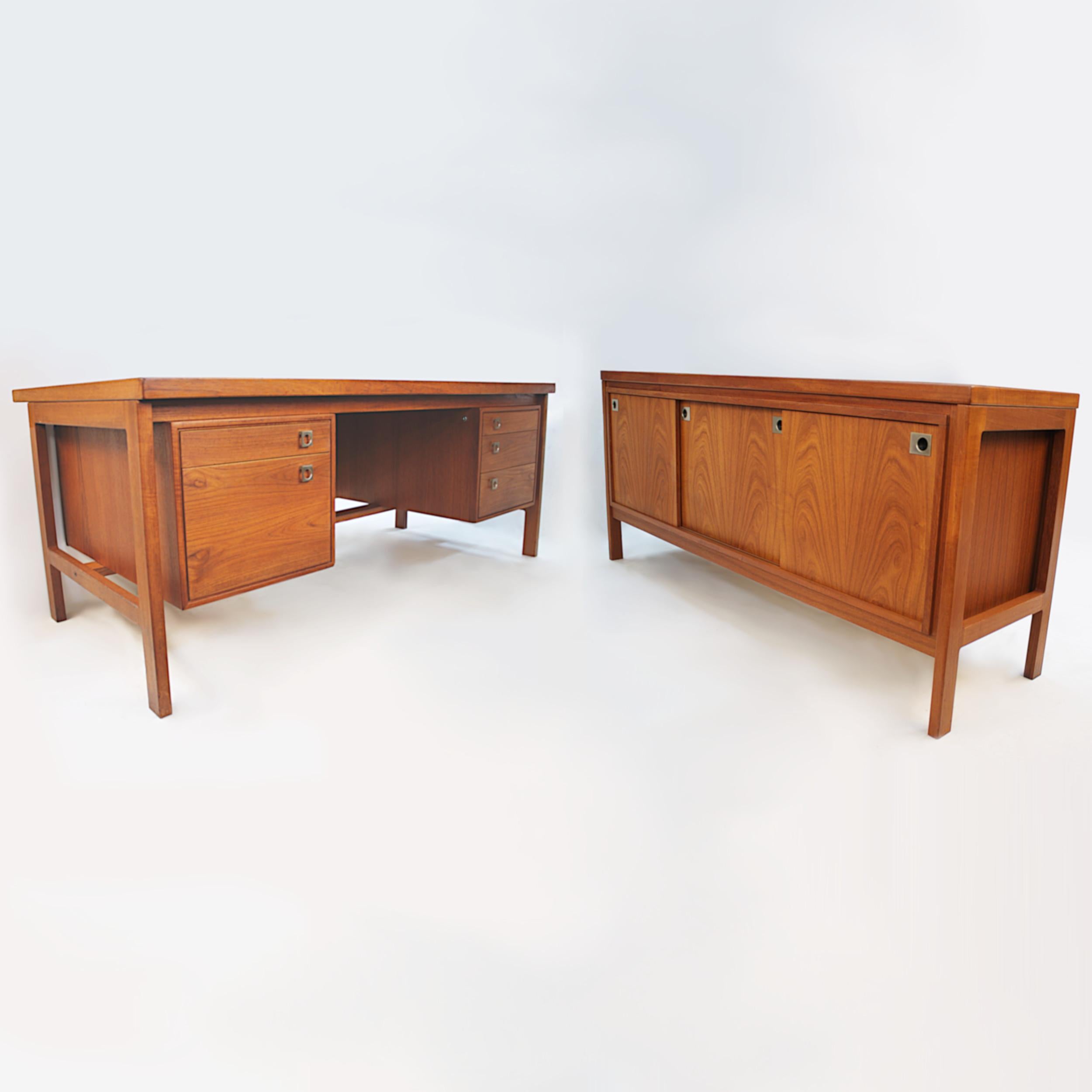 This is a wonderful matching office set designed by Arne Vodder for Danish furniture manufacturer H.P. Hansen. Set includes:

Desk

- Book-matched teak veneer
- Solid teak frame
- Brushed aluminum hardware
- Five drawers

Dimensions: 69