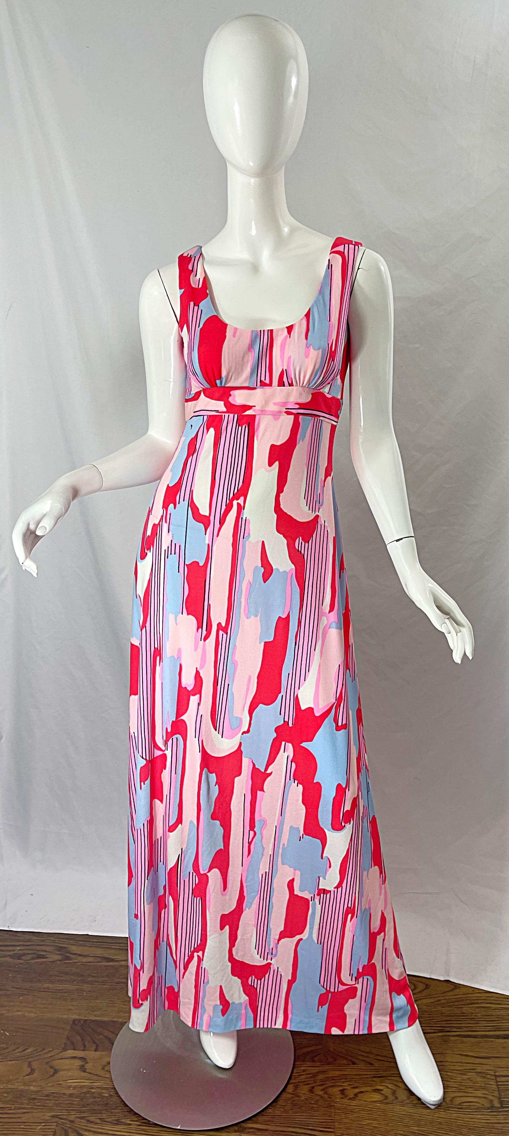 Amazing vintage 70s MAURICE signed pink, blue, coral and white jersey maxi dress ! Features abstract prints with the Maurice signature throughout. Hidden zipper up the back with hook-and-eye closure. Can easily be worn for any day or evening event.