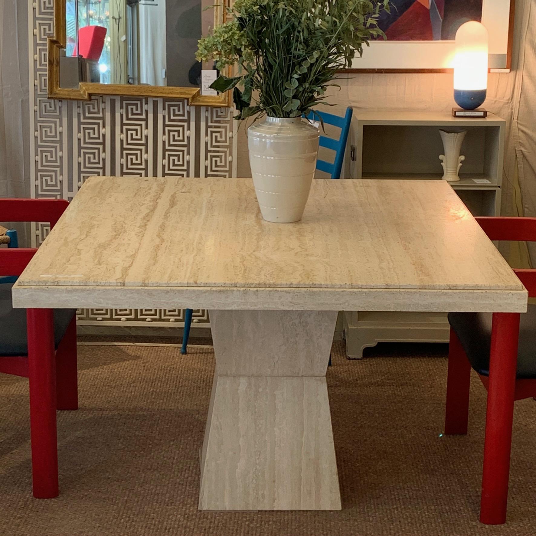 Really great square travertine pedestal table that is versatile for smaller dining or center table. Sold through modern furniture retailer Maurice Villencey in the 1970s.