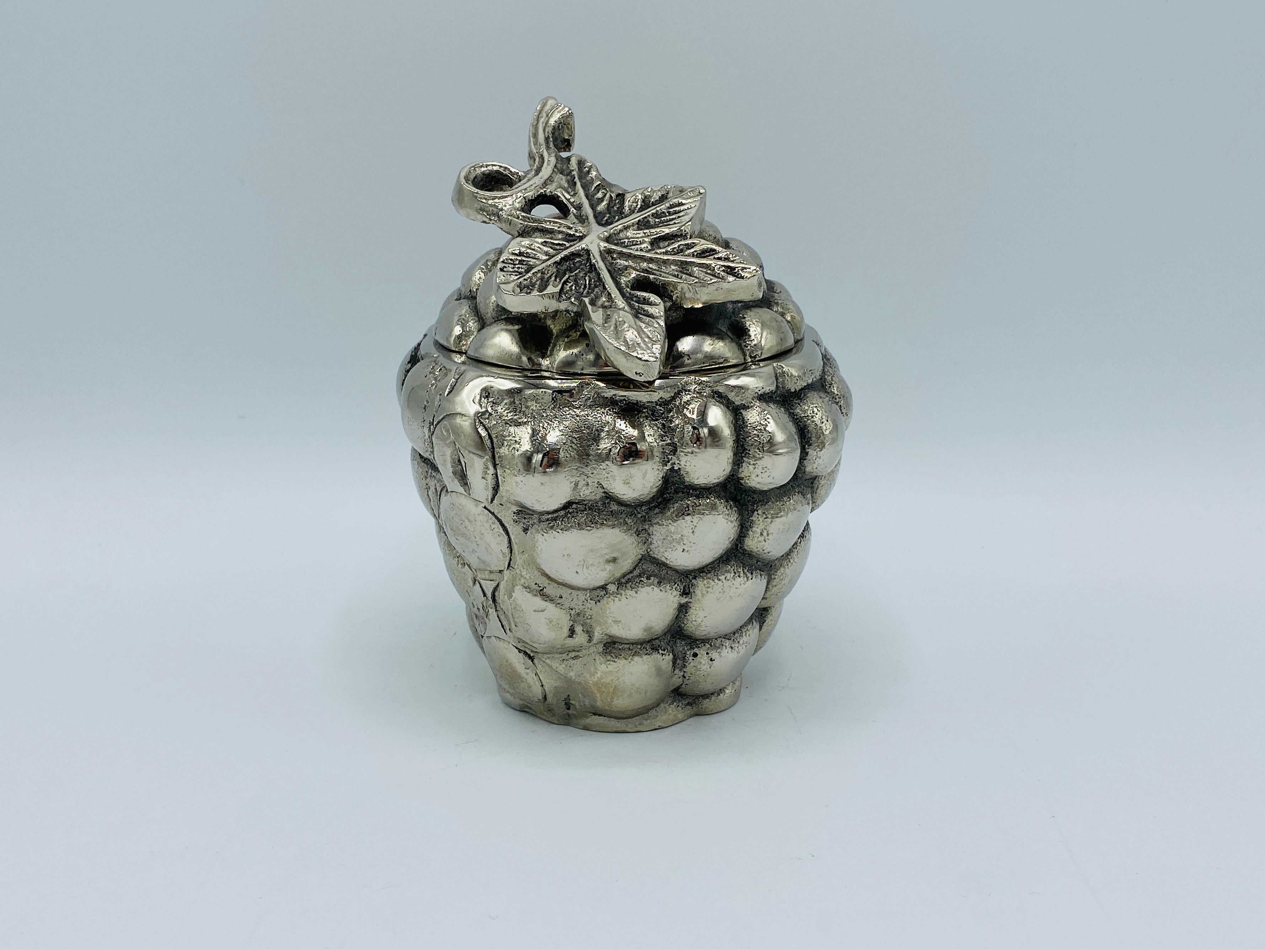Listed is an Italian silvered metal grape cluster sculpture box, in style of Mauro Manetti, circa 1970s. This piece greatly resembles renowned Italian artist, Mauro Manetti, though is unsigned and in the style of. Truly a lovely piece with heavy