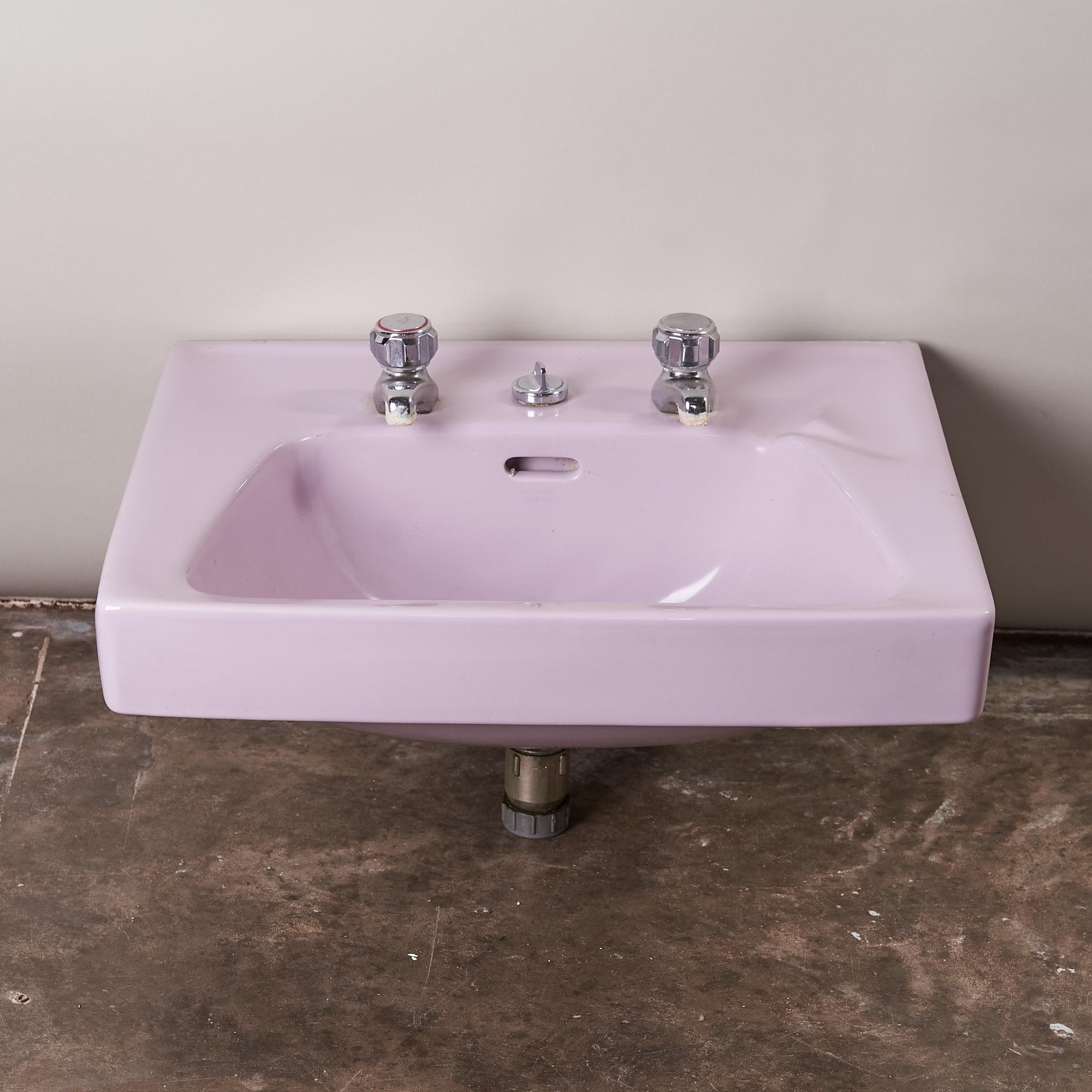 A number available of reclaimed 1970s Armitage Shanks mauve wash hand basins with original chrome taps. Model 'Herculex 4169-22'.