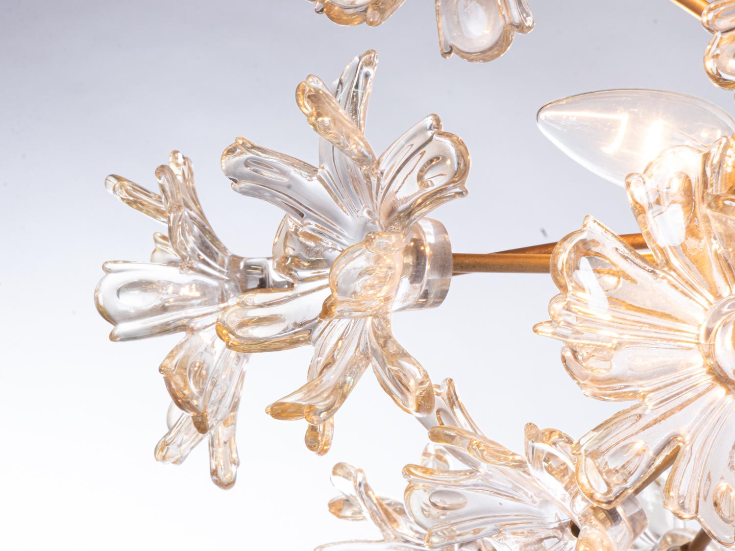 Elegant vintage mid century Murano flower bouquet flush mount chandelier with amber tinted glass hand blown Murano glass flowers on a brass frame. Manufactured in Italy, 1970s. 

Maker: Mazzega attr. 
Measures: dm 23.62