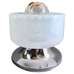 1970s Mazzega attributable Murano art glass and chrome one-light table lamp.