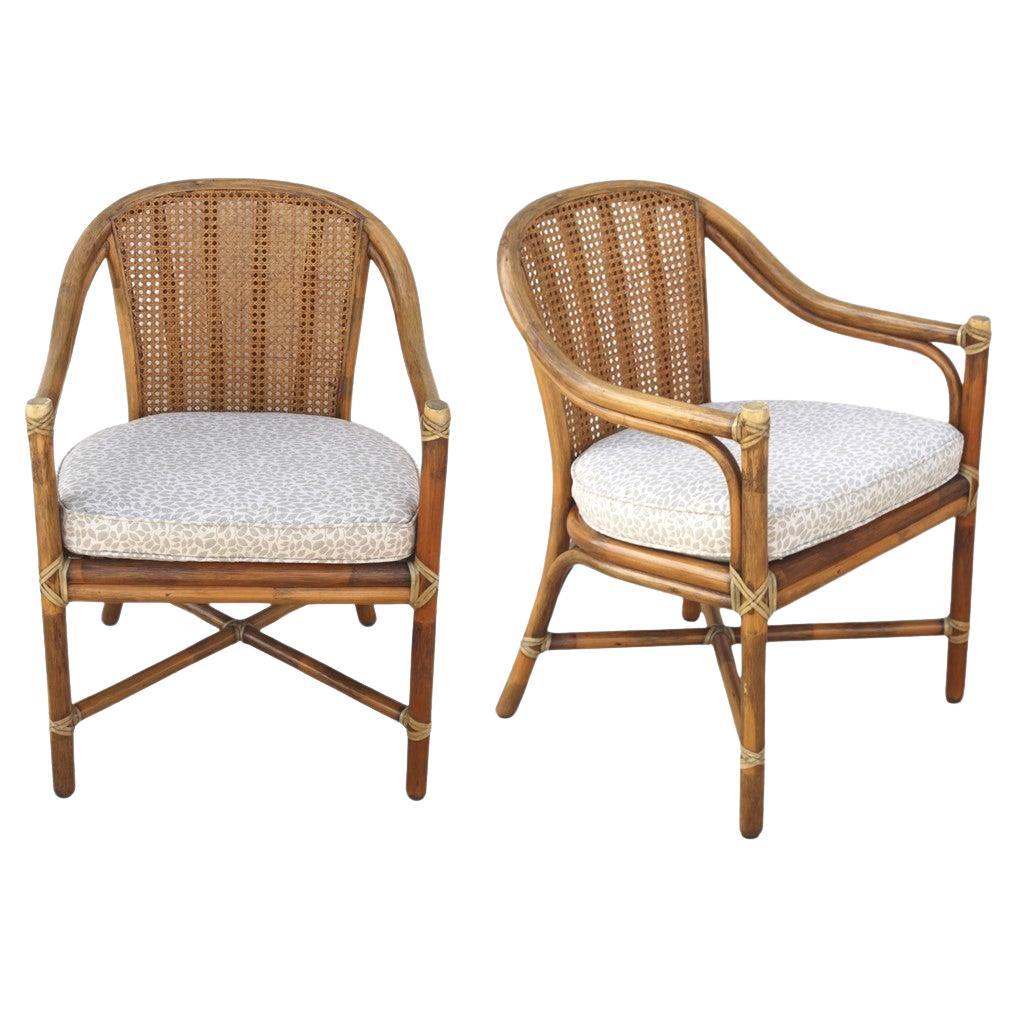 Casual luxury from McGuire San Francisco. A pair of vintage 1970s organic modern chairs designed in the classic tradition using beautiful materials simply and sensitively. This expertly handcrafted pair of armchairs features a cane seat back and