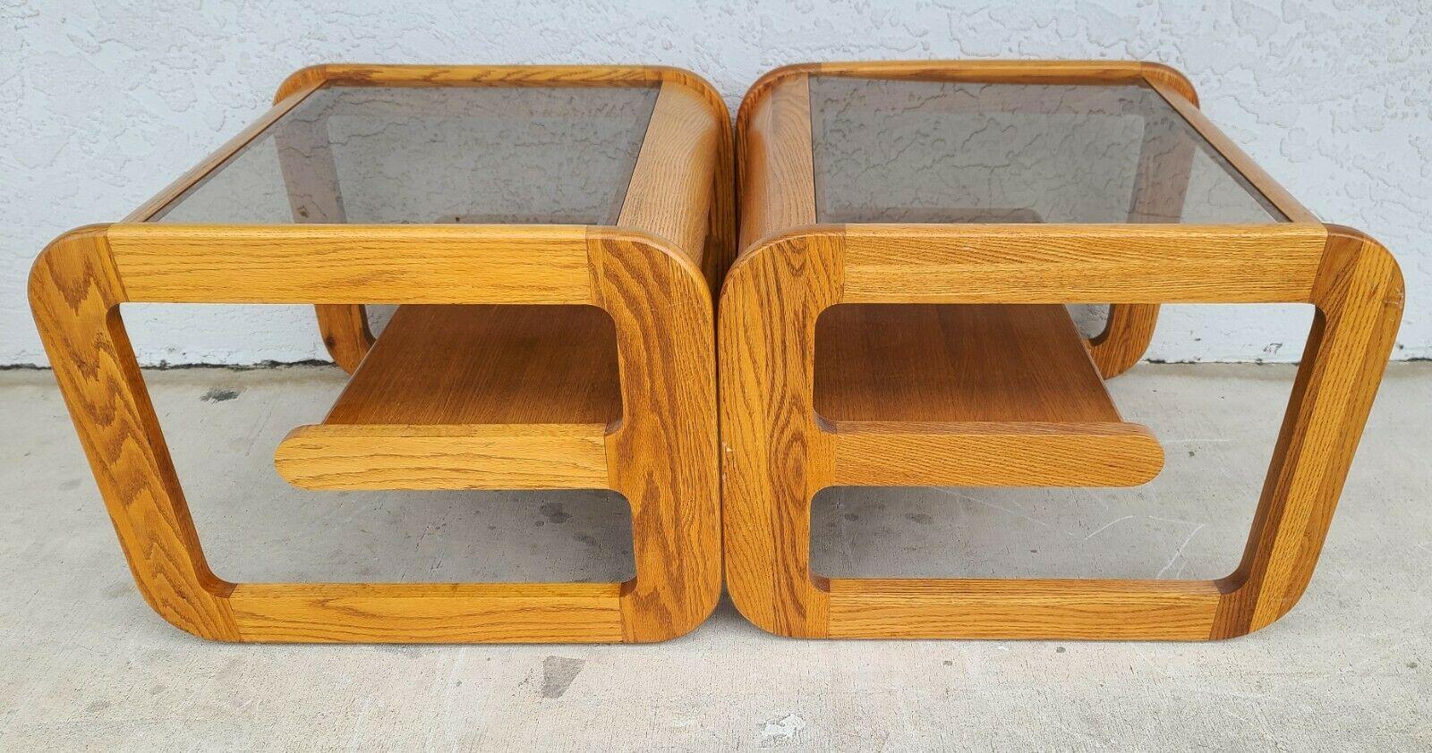 For full item description be sure to click on CONTINUE READING at the bottom of this listing.

Offering one of our recent palm beach estate fine furniture acquisitions of a
set of (2) 1970's Mid-Century Modern Lou Hodges Mersman style oak smoked