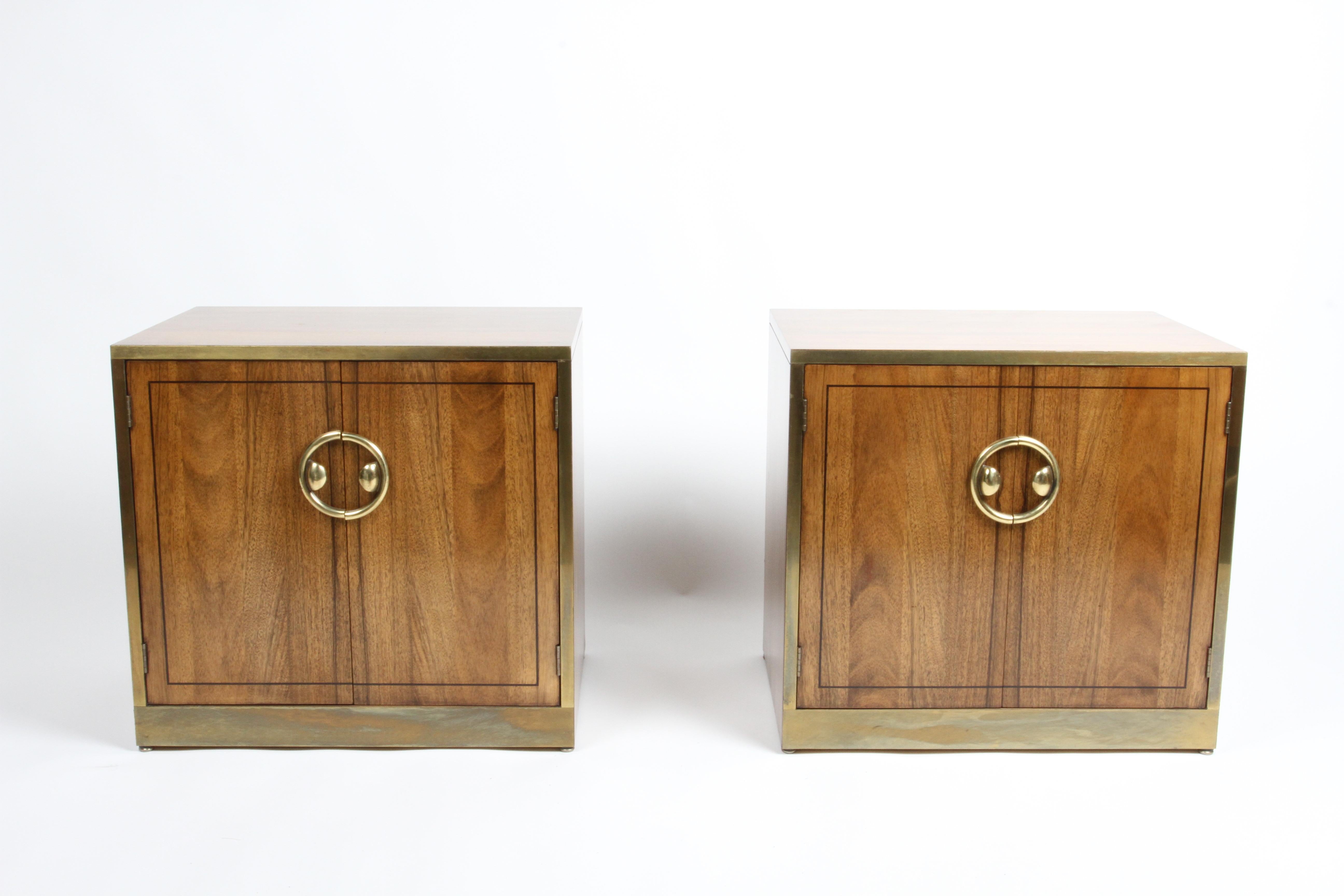 Fantastic pair of restored Mid-Century Modern Mastercraft nightstands or end tables in bleached Rosewood with brass handles and trim. The exterior of the cabinets have been refinished, the insides are very nice, patina to brass trim. The interior of