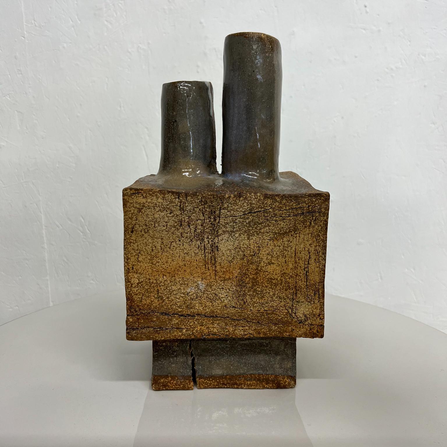 1970s MCM Pottery in brutalist style. Not perfect. With imperfections, looks like the clay fractured during heat process. Still strong and sturdy.
Bold and good looking.
No signature.
Measures: 6.88 wide x 5.38 deep x 12.75 tall
Preowned