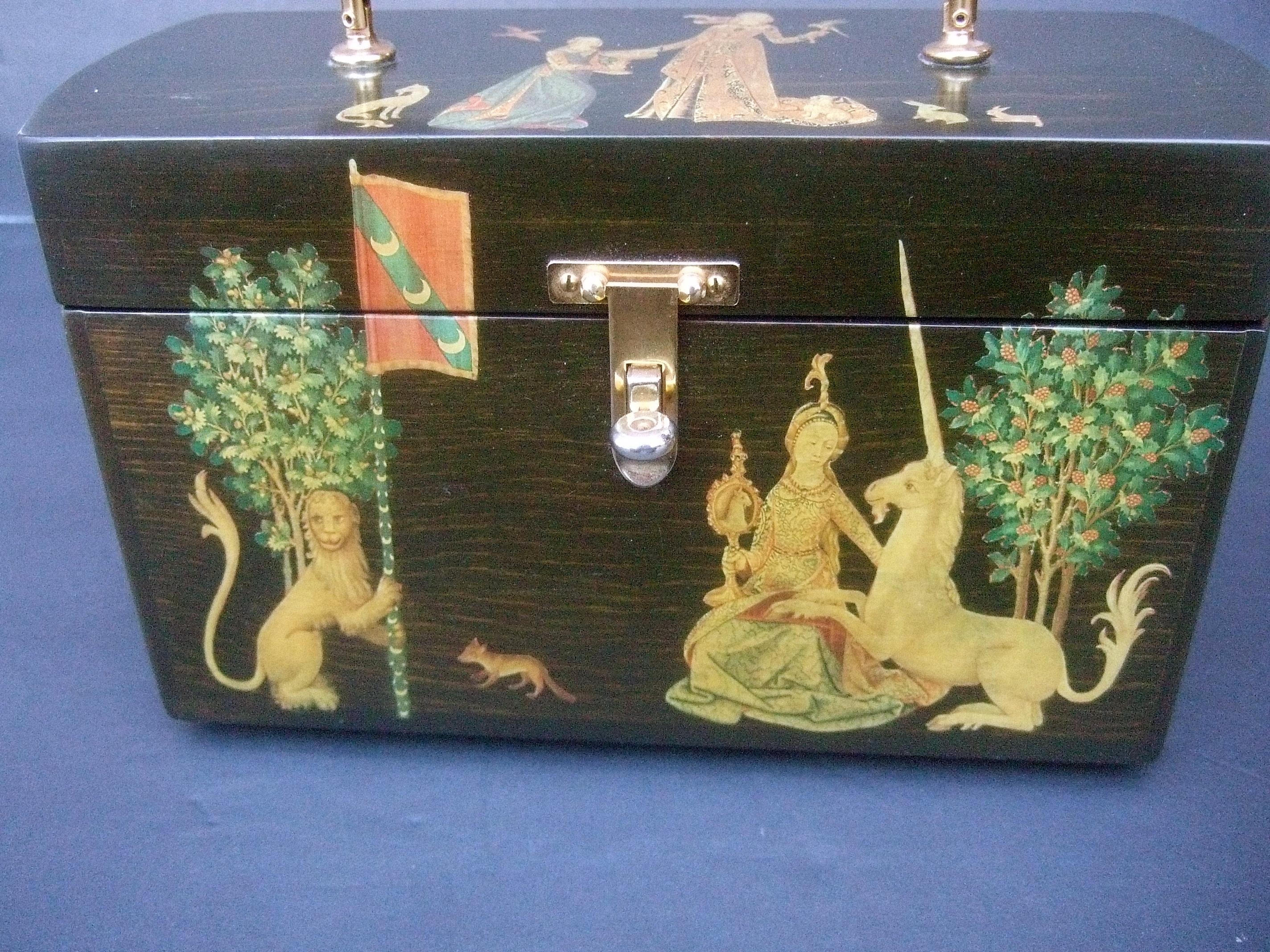 1970s Medieval style wood decoupage box purse  
The unique wood box purse is decorated with medieval scenes illustrated with a royal maiden surrounded by a mythical unicorn, majestic lion, a horse & a few small creatures 

The medieval scene is