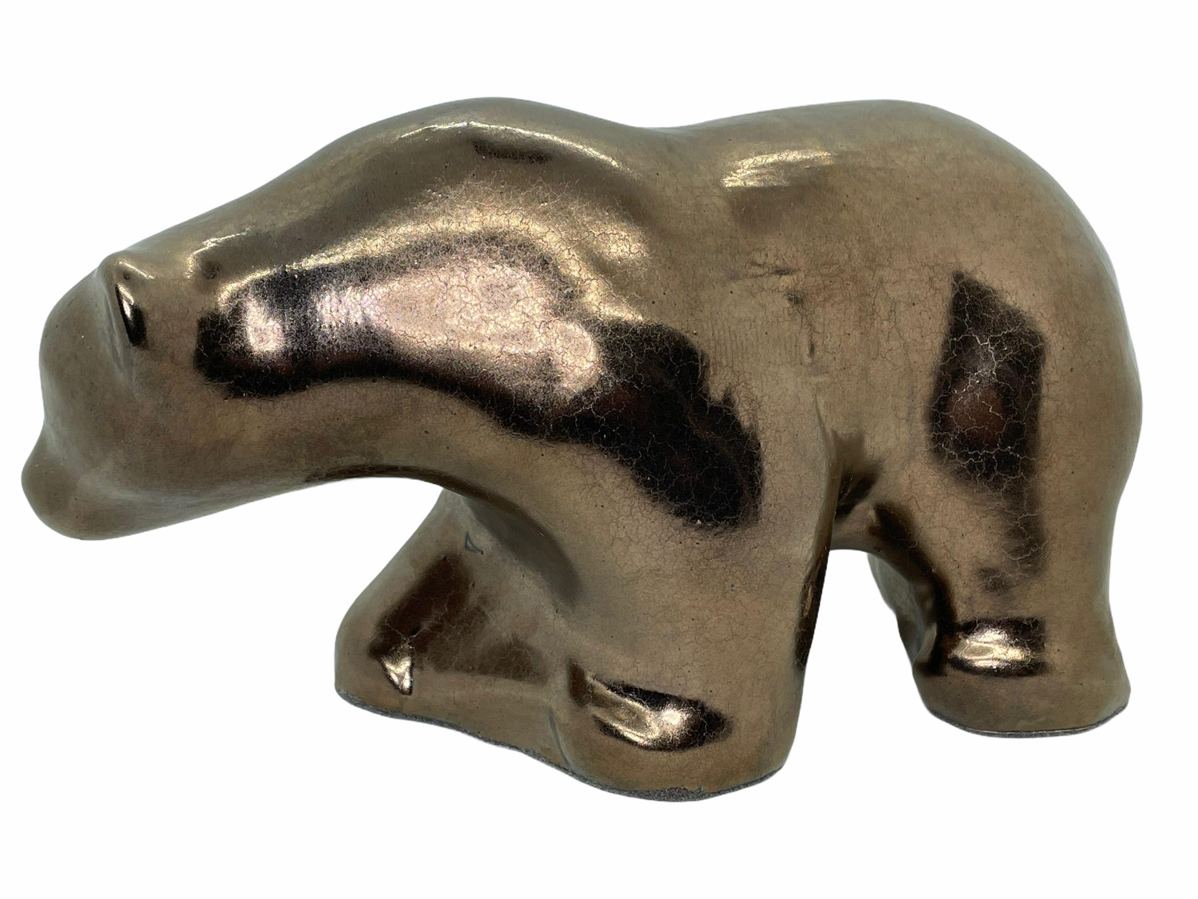 An amazing metallic glazed ceramic Mid-Century Modern bear figurine statue, made in Germany, circa 1970s by Otto Keramik. Copper and earthen colors. It is in very good condition with no chips, cracks, or flea bites. With the original Label.