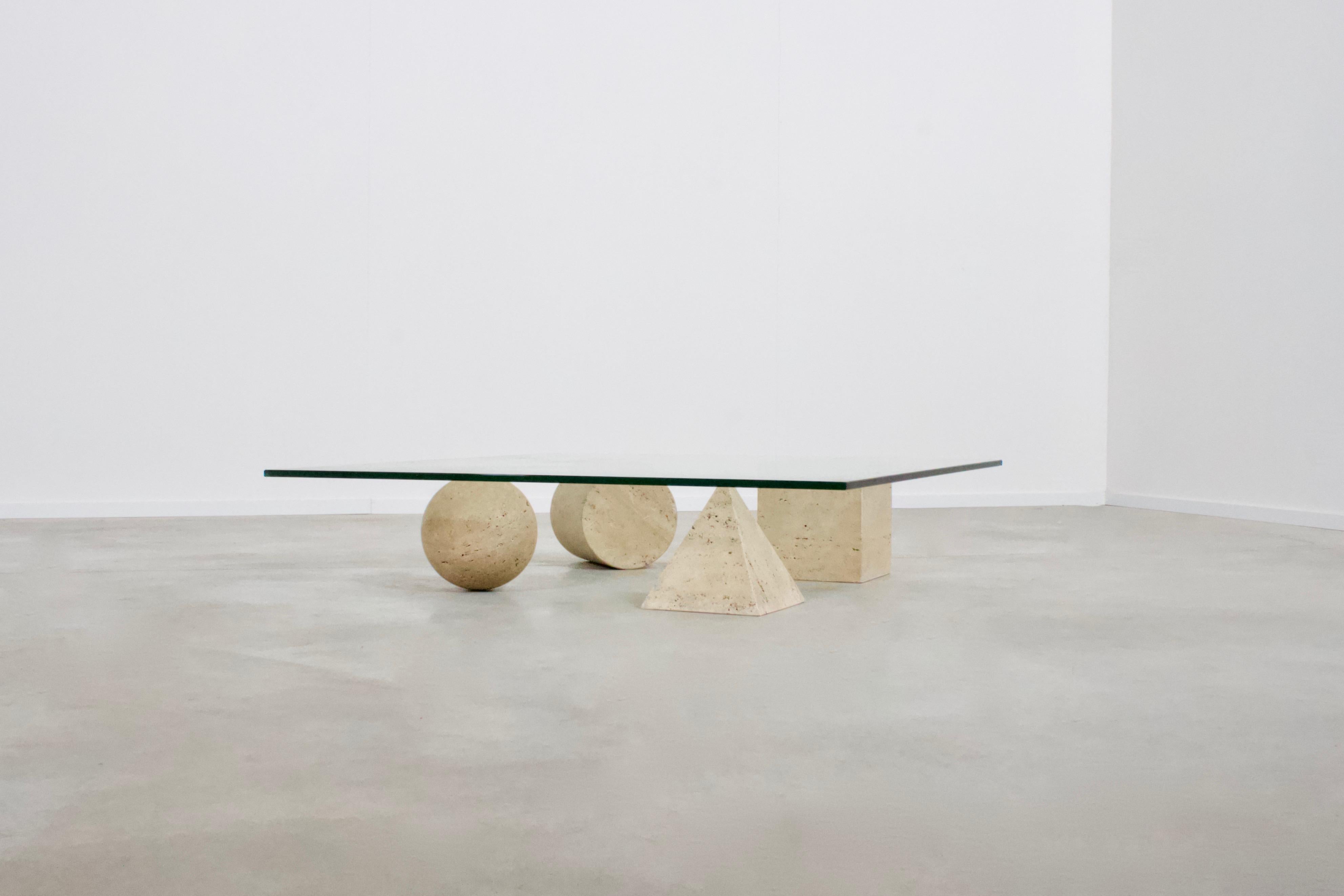 Impressive Metaphora coffee table in very good condition.

This coffee table is designed by Massimo & Lella Vignelli in 1979 

Four forms of the Euclidean geometry, the cube, the cylinder, the sphere and the pyramid, are represent the basis of the