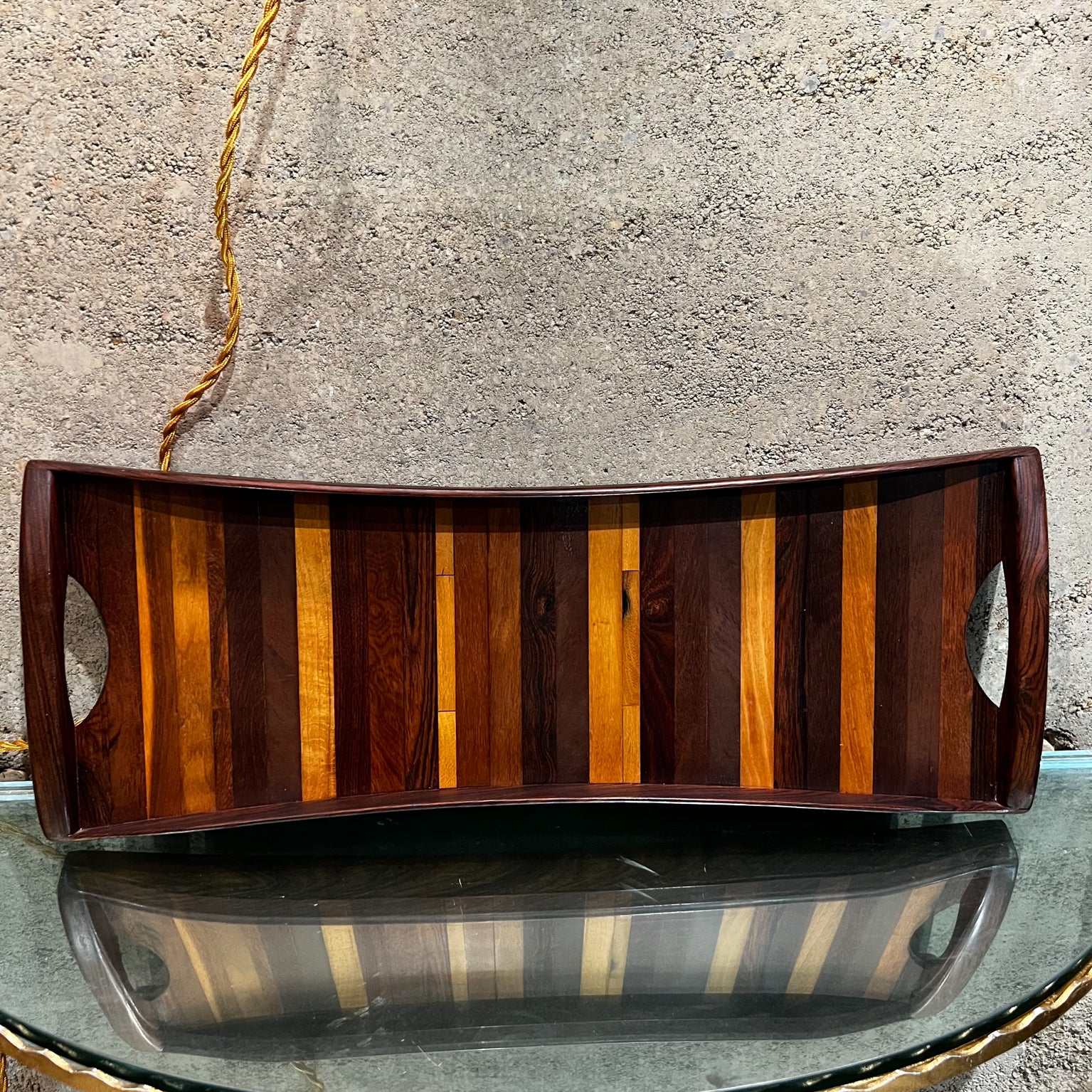 1970s Designed by Don Shoemaker and produced by Señal Mexico 
Midcentury Service Tray medley of exotic woods
Cut out the handle for easy carry.
Tray 8.25 w x 21.75 long x 1.75 d
Discreet mounting hardware is affixed to the back of the