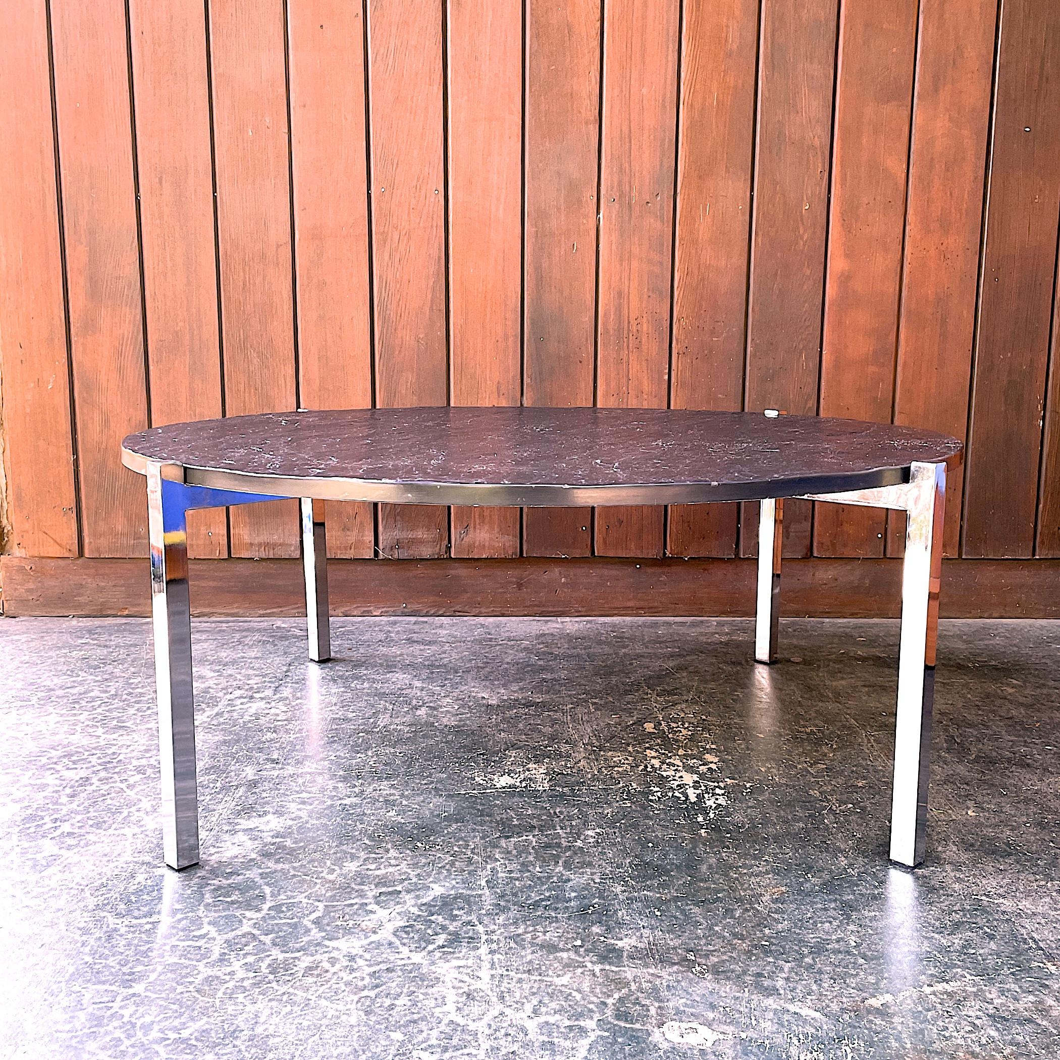 Procured from a 70s time capsule estate, designer for this table is unknown. Polished and chrome plated base, with cool blue plastic plugs to bottoms of each leg. Its a very well made piece with a very heavy top, about 70 lbs. Top showing some light