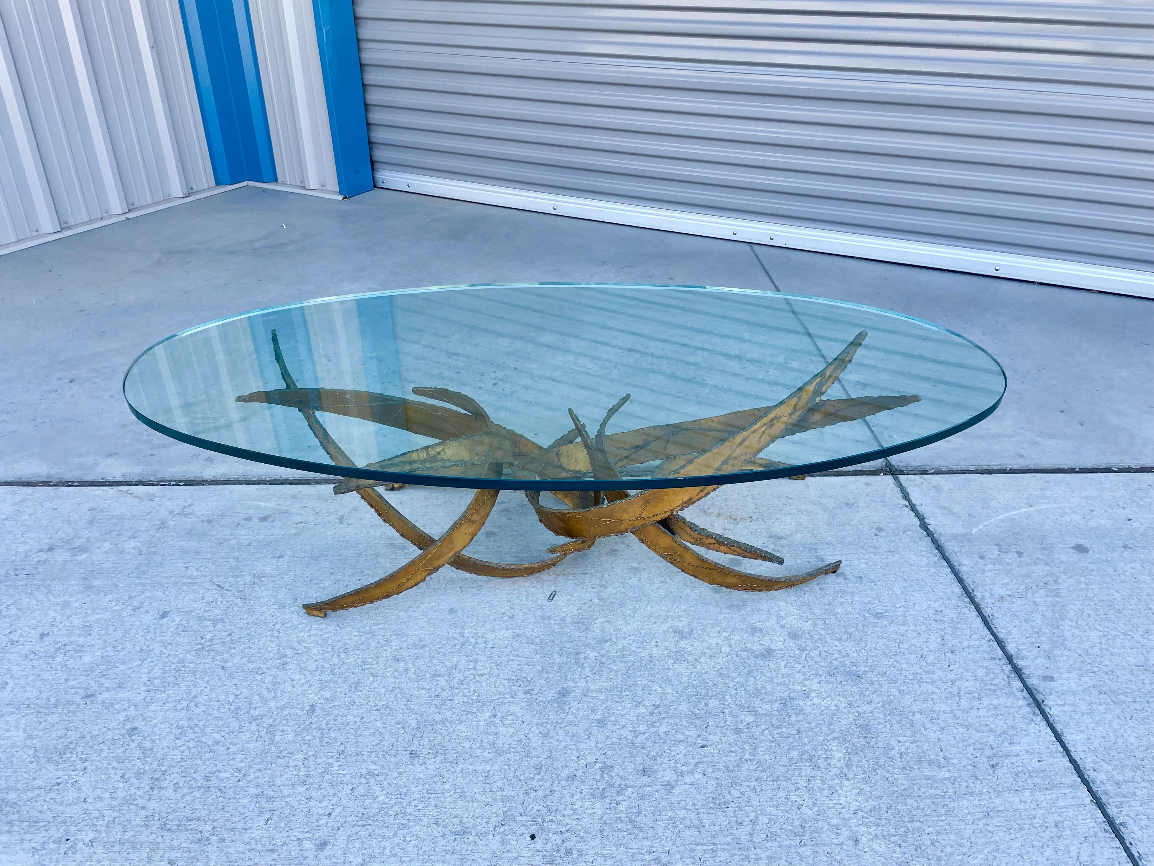 Mid-century brutalist coffee table designed and manufactured by Silas Seandel circa 1970s. This piece is a true work of art. The table is made up of multiple sections of iron that have been expertly welded together to create a beautiful flame