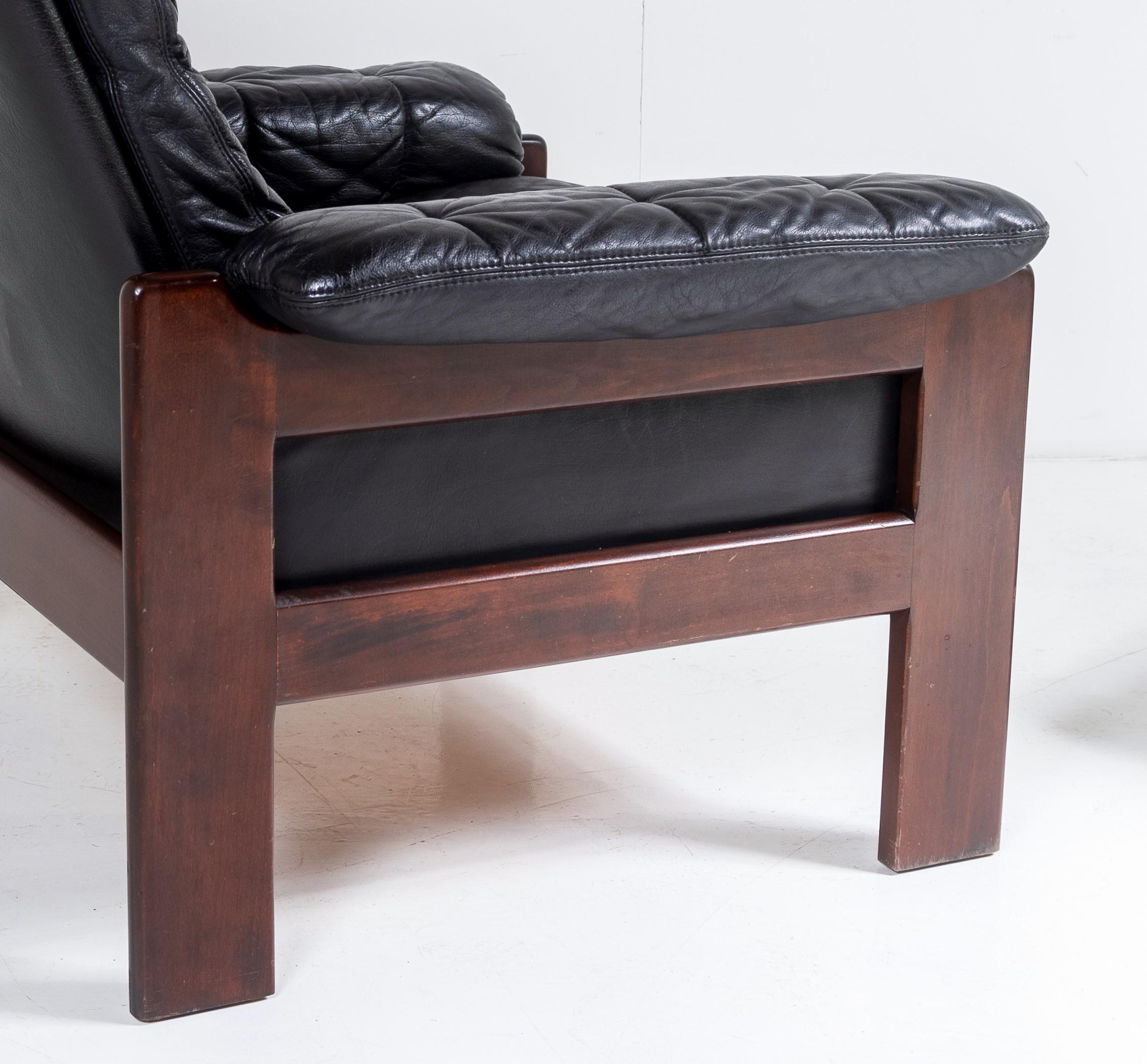 1970s Mid Century Danish Teak Rosewood and Black Leather Armchair and Footstool For Sale 1
