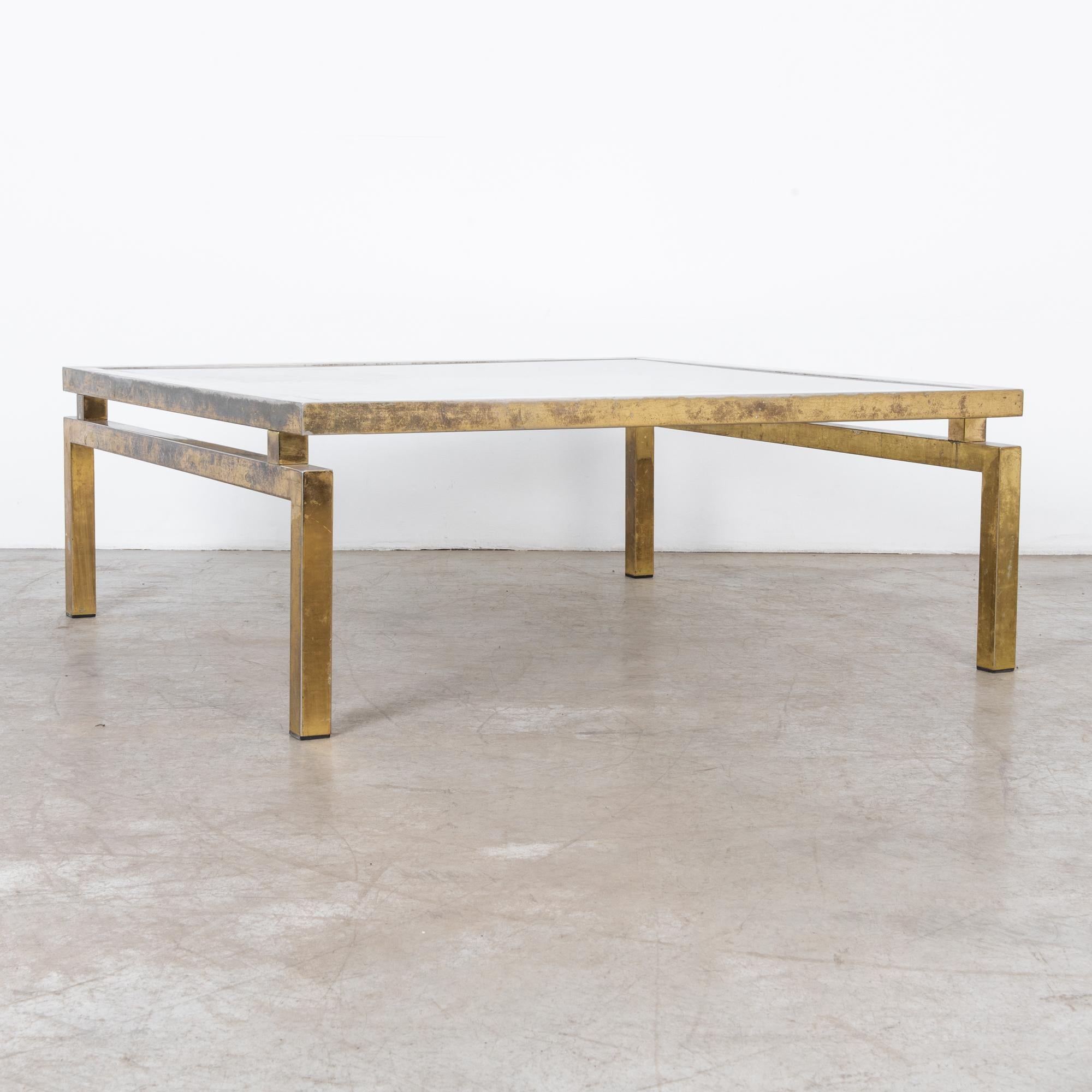Stylish coffee table with glass top and brass-plated legs. A timeless combination, metal and glass. It screams modernity, precision speed and luxury. The optics of glass recalls primordial associations. Adopted and expanded in the industrial age,