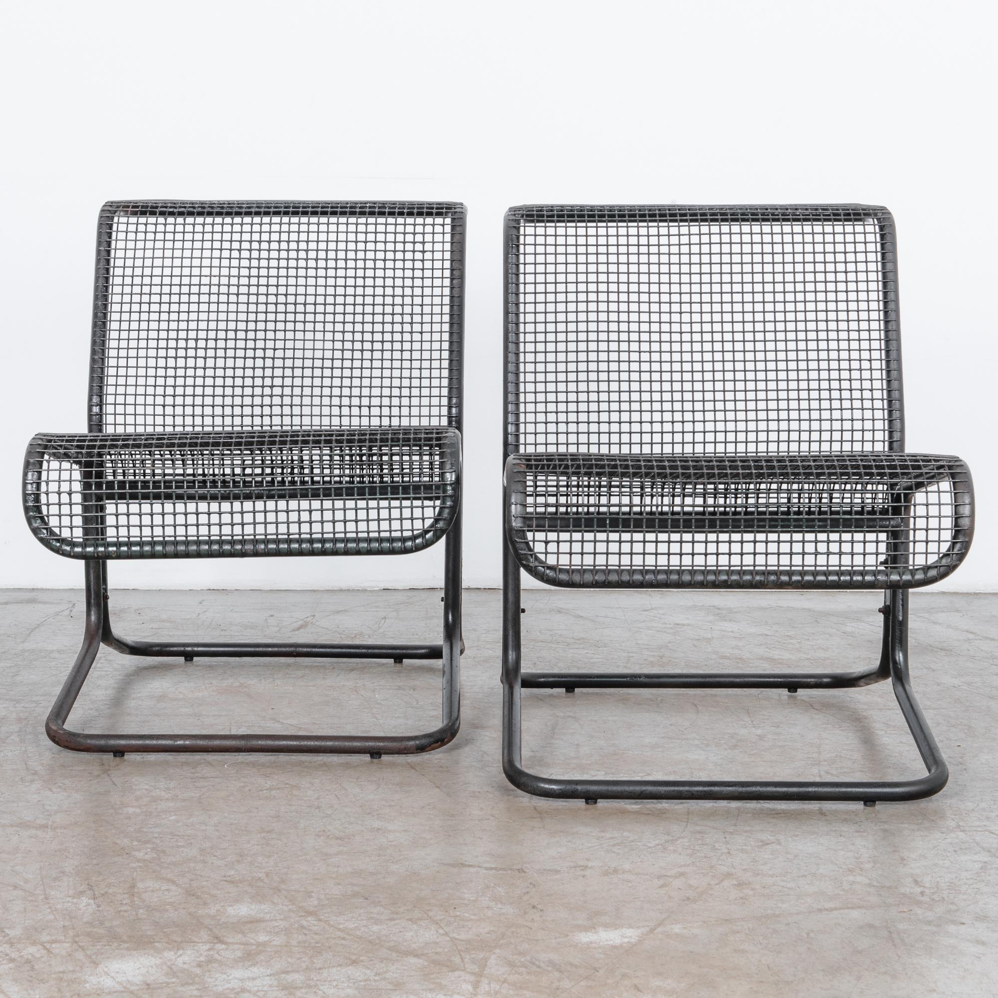 Black enameled tubular steel frame with metal mesh back and seat. From circa 1970 Czech Republic these chairs stylishly blend the elements of design and practicality with a rugged and attractive metal frame.