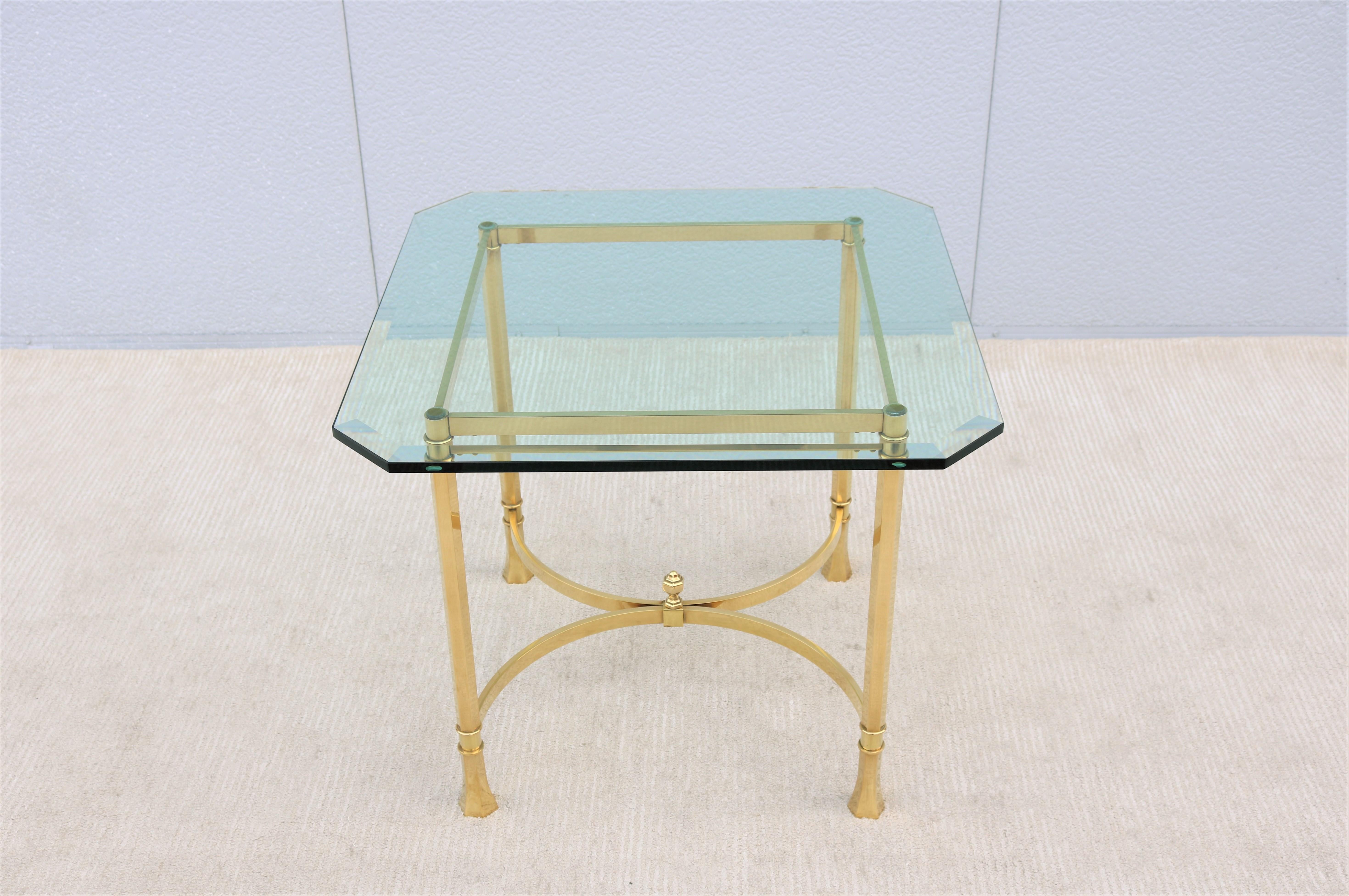 Stunning and elegant Maison Bagues style brass and glass square side table.
Features brass hexagon-shaped legs and a cross stretcher with a center ball finial.
The glass top features a classy and artistic polished beveled edge style, with deep