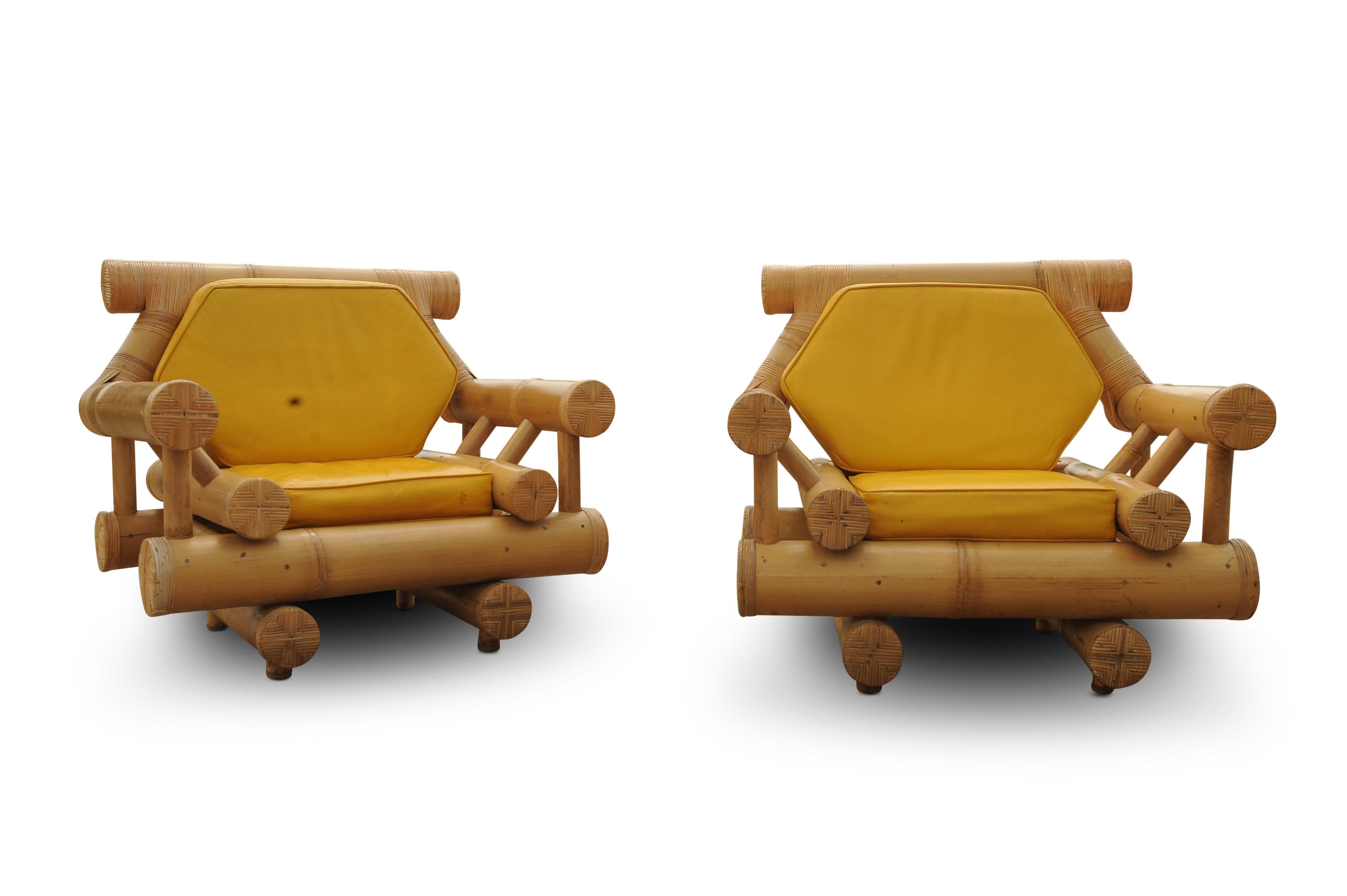 A Matching Pair of Budji Layug Bamboo Lounge Chairs With Mustard Yellow Loose Leather Cushions 1970's Price per chair.

Height to seat pad 42cm
Height to top of arms 86cm
Width of chair at widest 62.5cm
Depth of the seat pad 48cm

A set of timeless