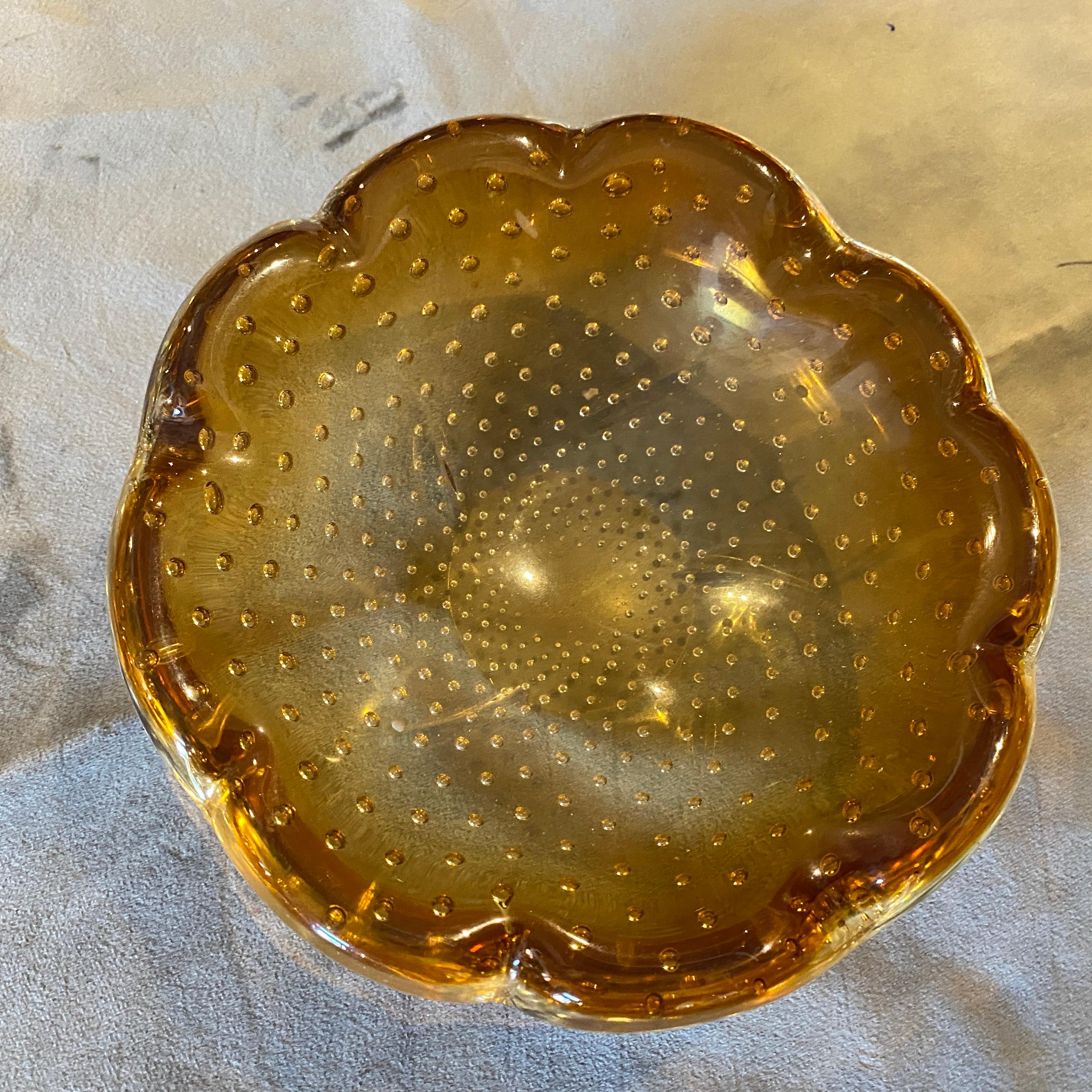 A bullicante brown murano glass ashtray in the style of Barovier, it has been made in Italy in the Seventies, it's in perfect conditions. This Murano Glass Ashtray is a masterpiece that harmoniously blends art and functionality. It stands as a