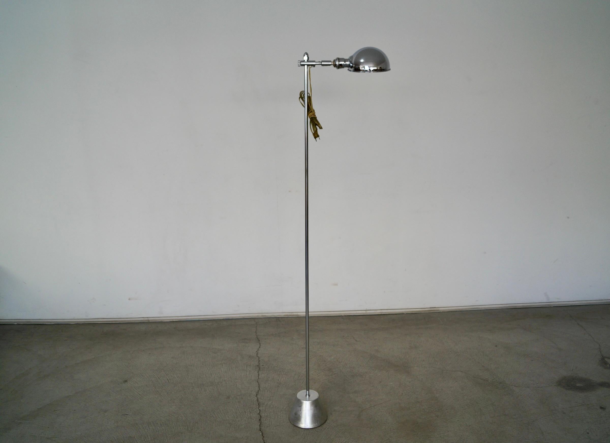 Vintage Mid century Modern floor lamp for sale. Manufactured by Bryant Lighting in the 1960’s, and an original Mid century lamp. It has a chrome dome lamp shade, and the height is adjustable. This lamp is rare, and has an aluminum and metal base.