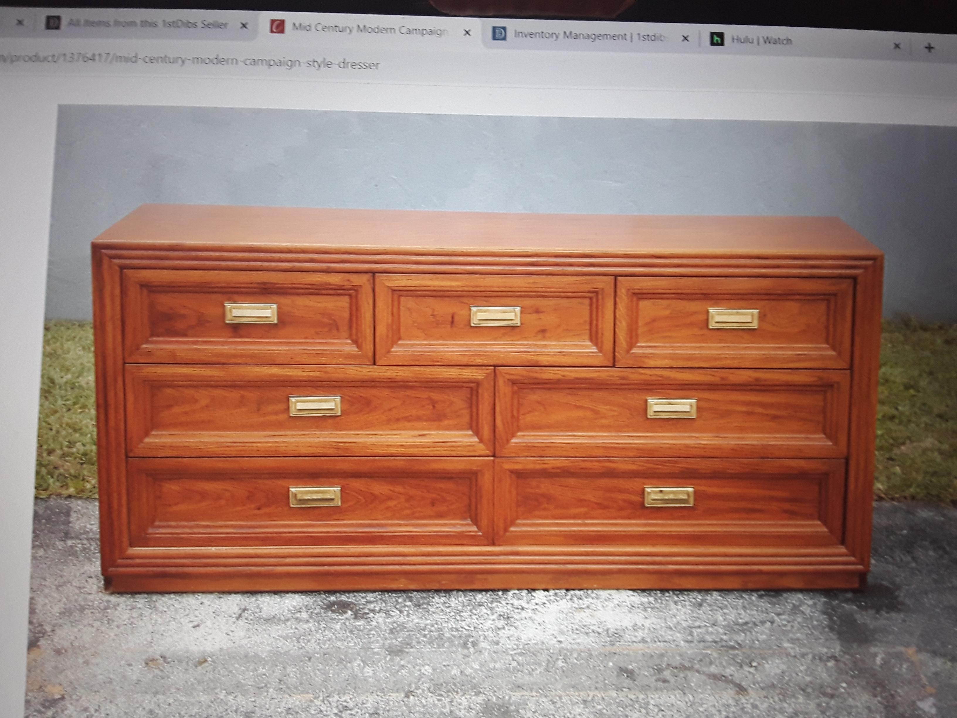 1970's Mid Century Modern 7 Drawer Campaign style Dresser by Thomasville. Beautiful hardware with a warm color tone.