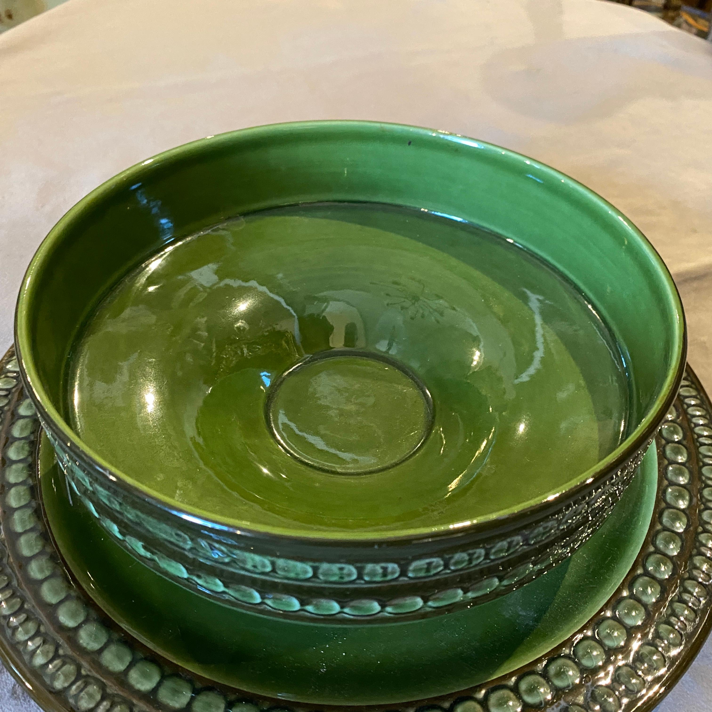 A modernist green ceramic bowl with its plate designed and manufactured in the Seventies by Ernestine Salerno, italian famous manufacturer. It's in perfect conditions.