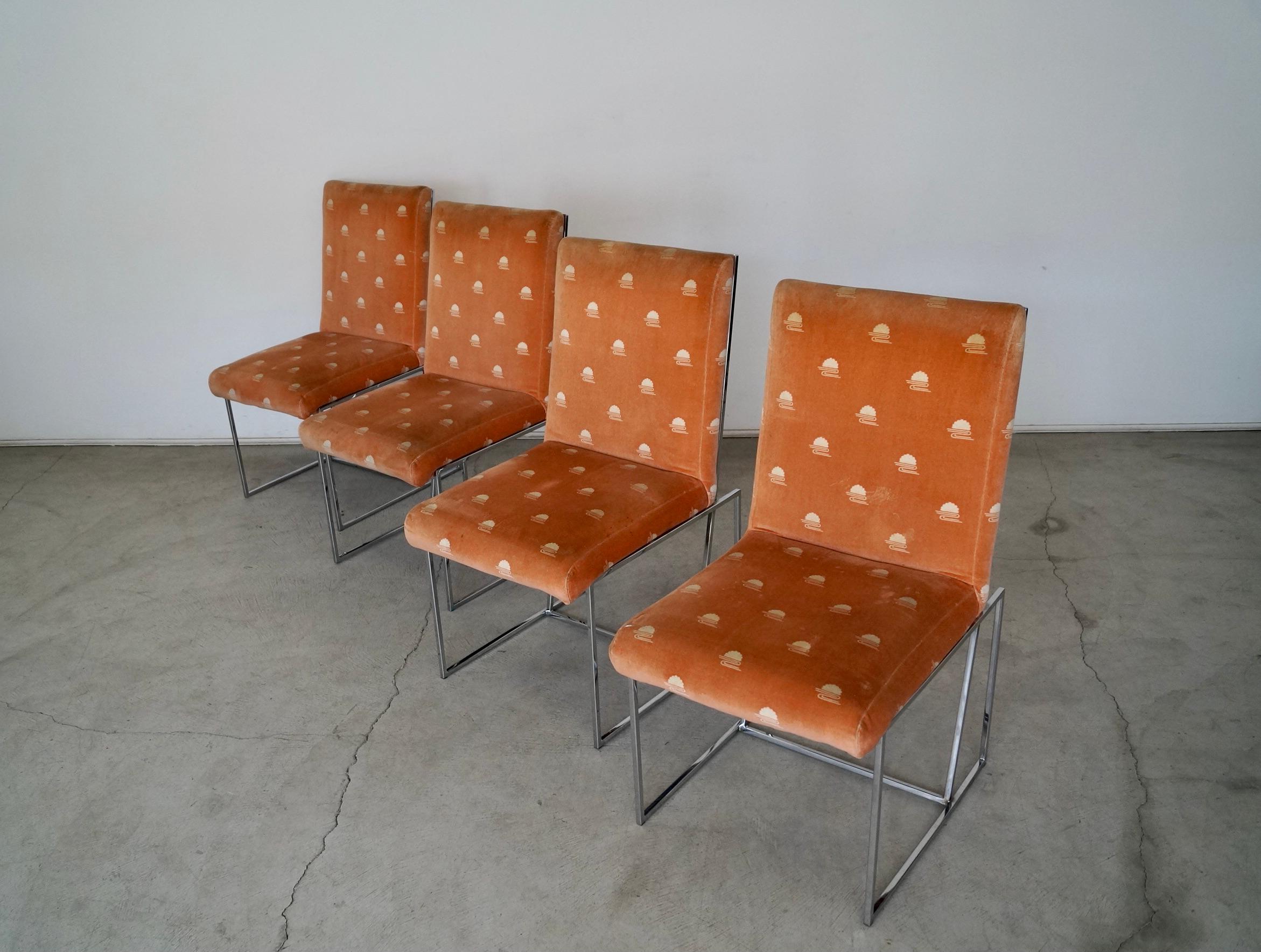 Vintage Mid-Century Modern dining chairs for sale. From the 1970's, and have an incredible design. They have a chrome frame with the original coral fabric with vintage pattern. The original fabric is worn and needs to be reupholstered in a new fresh