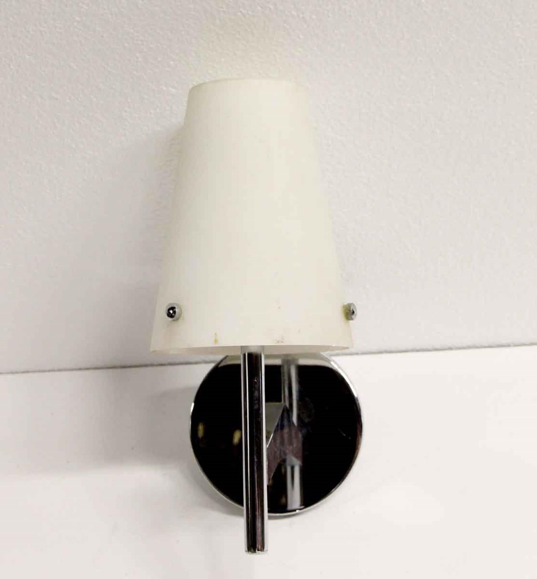 1970s Mid-Century Modern style chrome sconce featuring a white cone glass shade. Cleaned and rewired. Small quantity available at time of posting. Priced each. Please inquire. Please note, this item is located in our Scranton, PA location.