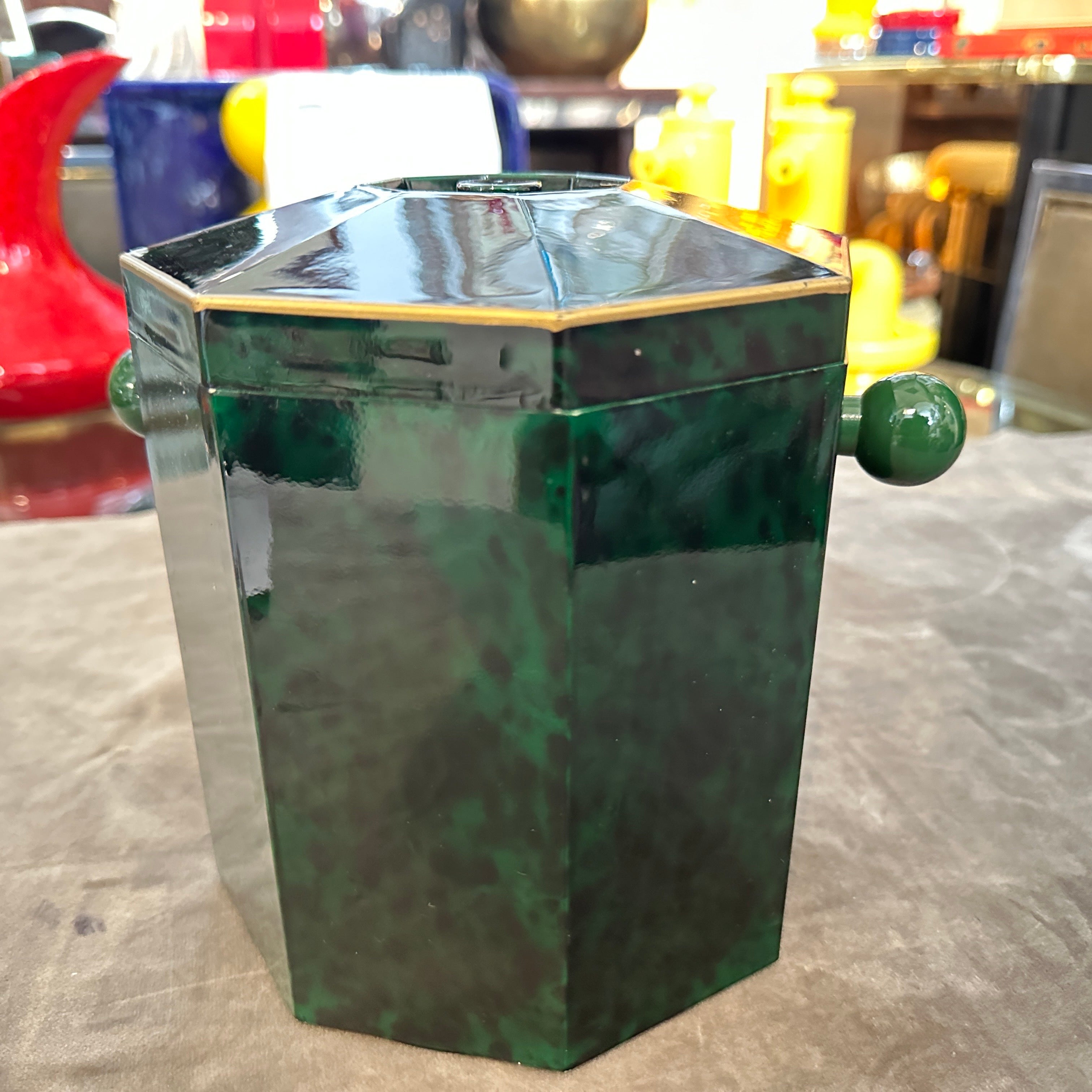 This 1970s Mid-Century Modern italian hexagonal ice bucket is a striking example of the era's bold yet refined design, combining high-quality  Lucite and with geometric shapes. This ice bucket has been a centerpiece for entertaining, used to hold