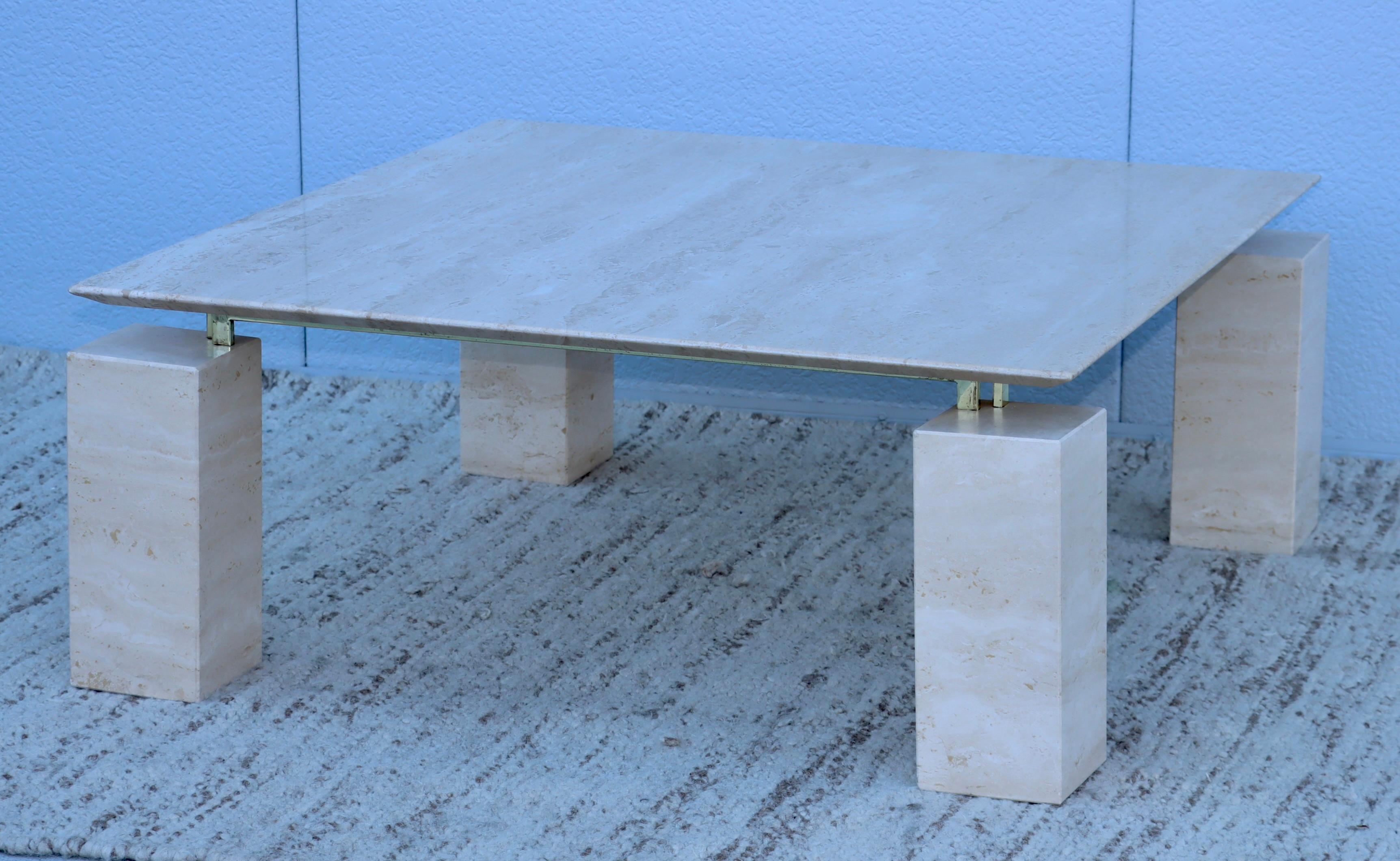 1970's Mid-Century Modern Italian floating top travertine coffee table, in vintage original condition with minor wear and patina to the travertine and some wear to the brass plated stretchers.