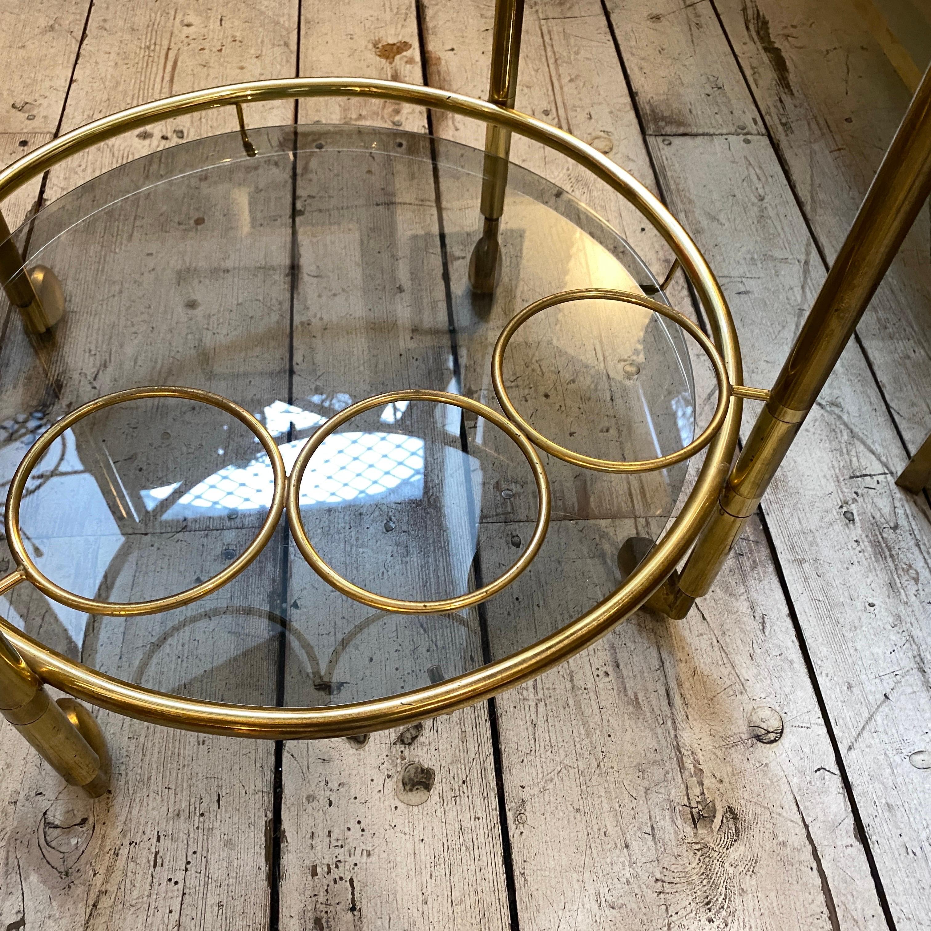 20th Century 1970s Mid-Century Modern Italian Brass and Light Smoked Glass Round Bar Cart For Sale