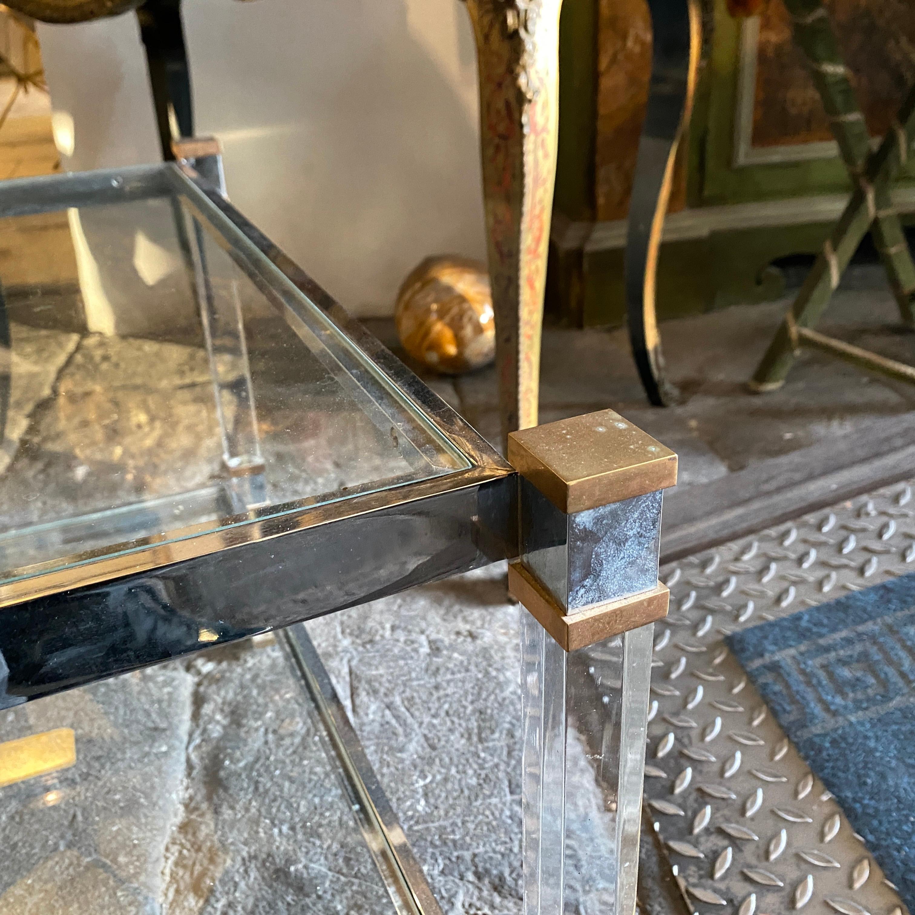 An high quality lucite, brass and glass coffee or side table in perfect conditions, it has been made in Italy in the seventies.