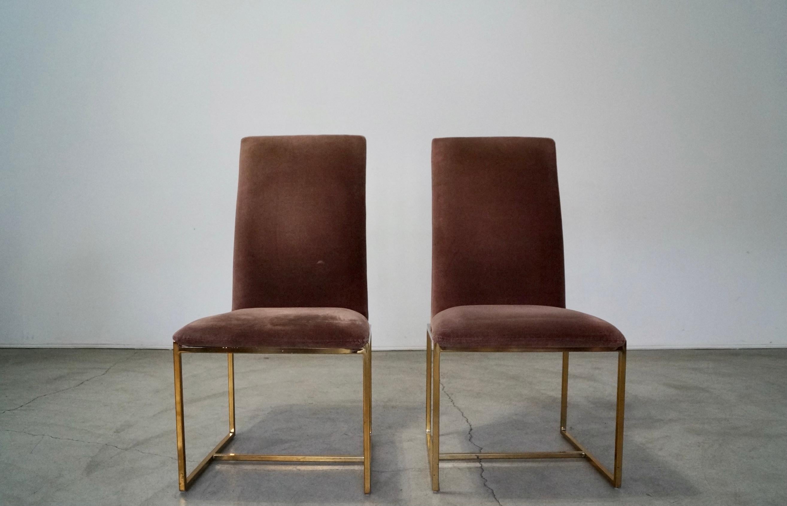 Vintage pair of 1970’s Mid-century Modern dining chairs for sale. They have a brass base with the original vintage velvet-like fabric in a dark mauve. Very well made chairs. The fabric is in good vintage condition with no rips or tears, but show