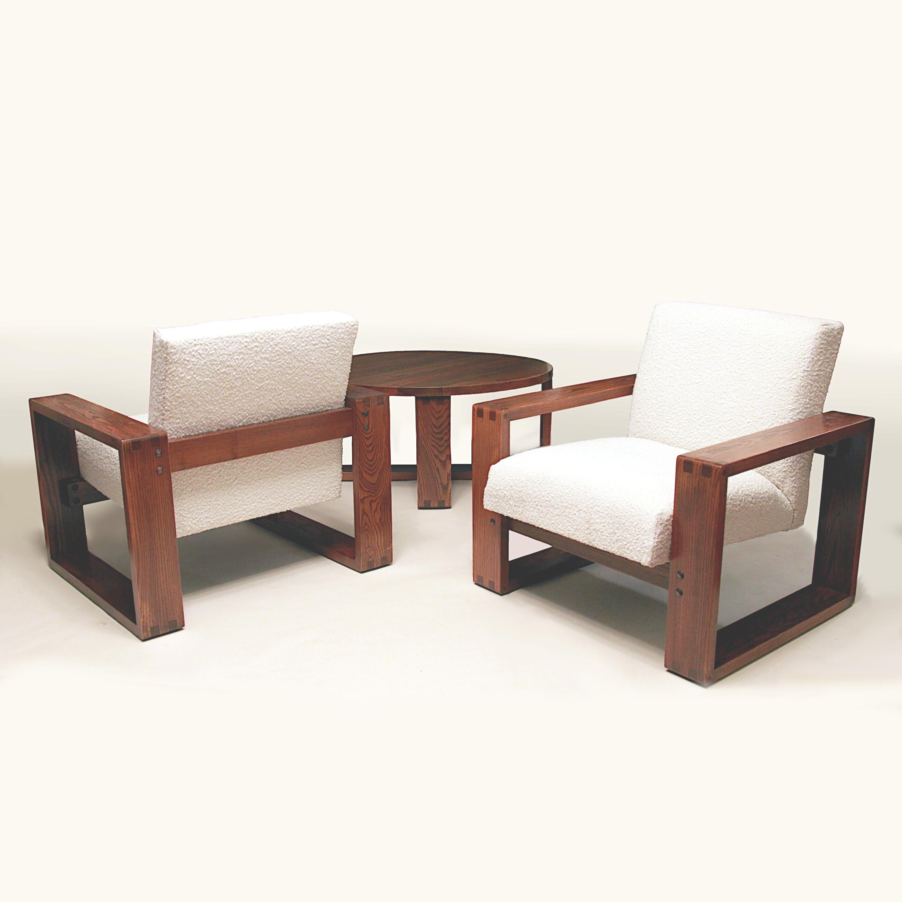 Spectacular 1970's vintage living room set by designer Hans Krieks.  Set features two lounge chairs and a matching coffe table all constructed from gorgeous, solid oak.  Both chairs have new cream-colored boucle fabric and beautifully complements