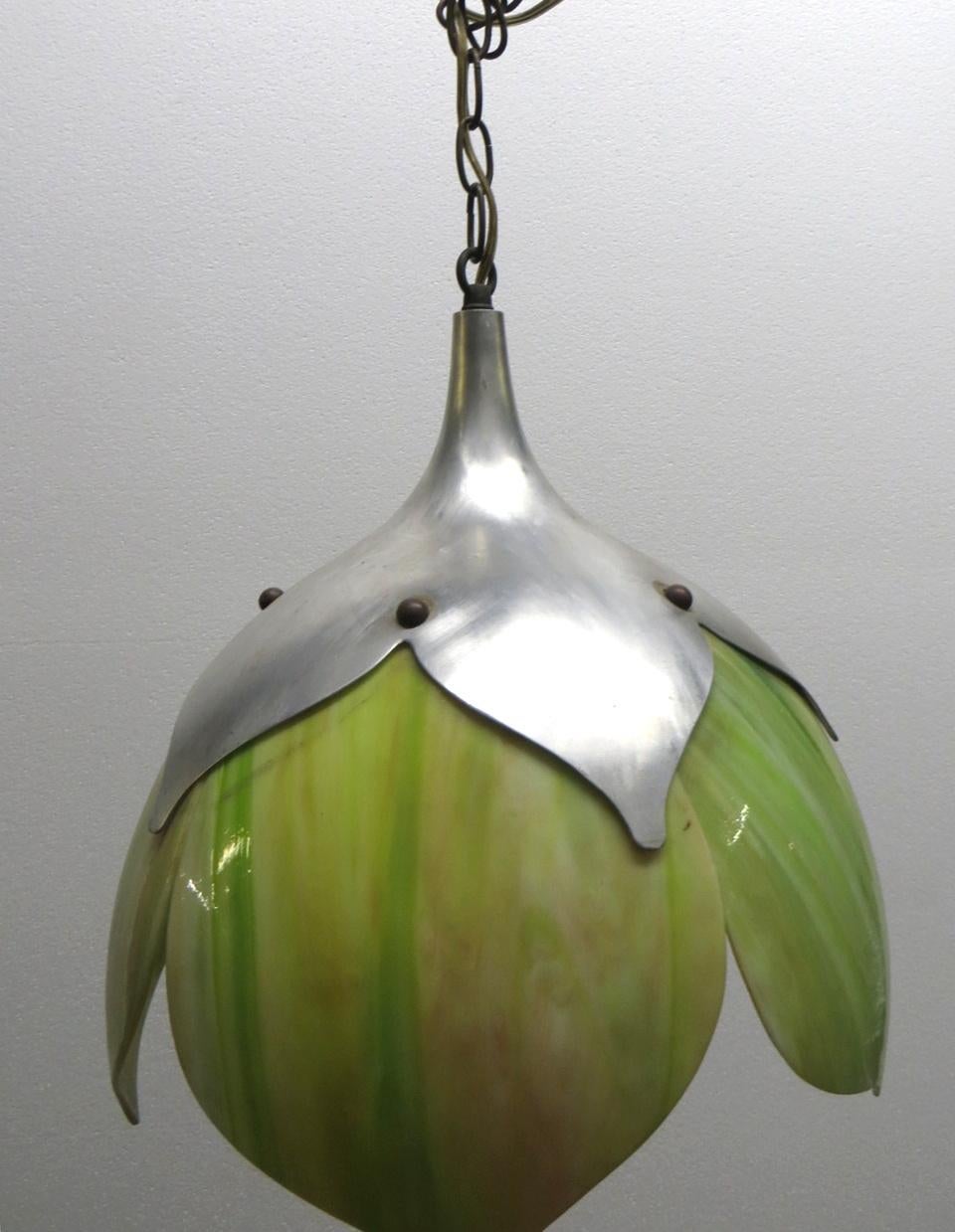 1970s hand blown Mid-Century Modern tulip pendant light with green stained glass with brushed steel fitter. This is a nice simple design, but colorful. This can be seen at our 400 Gilligan St location in Scranton, PA.