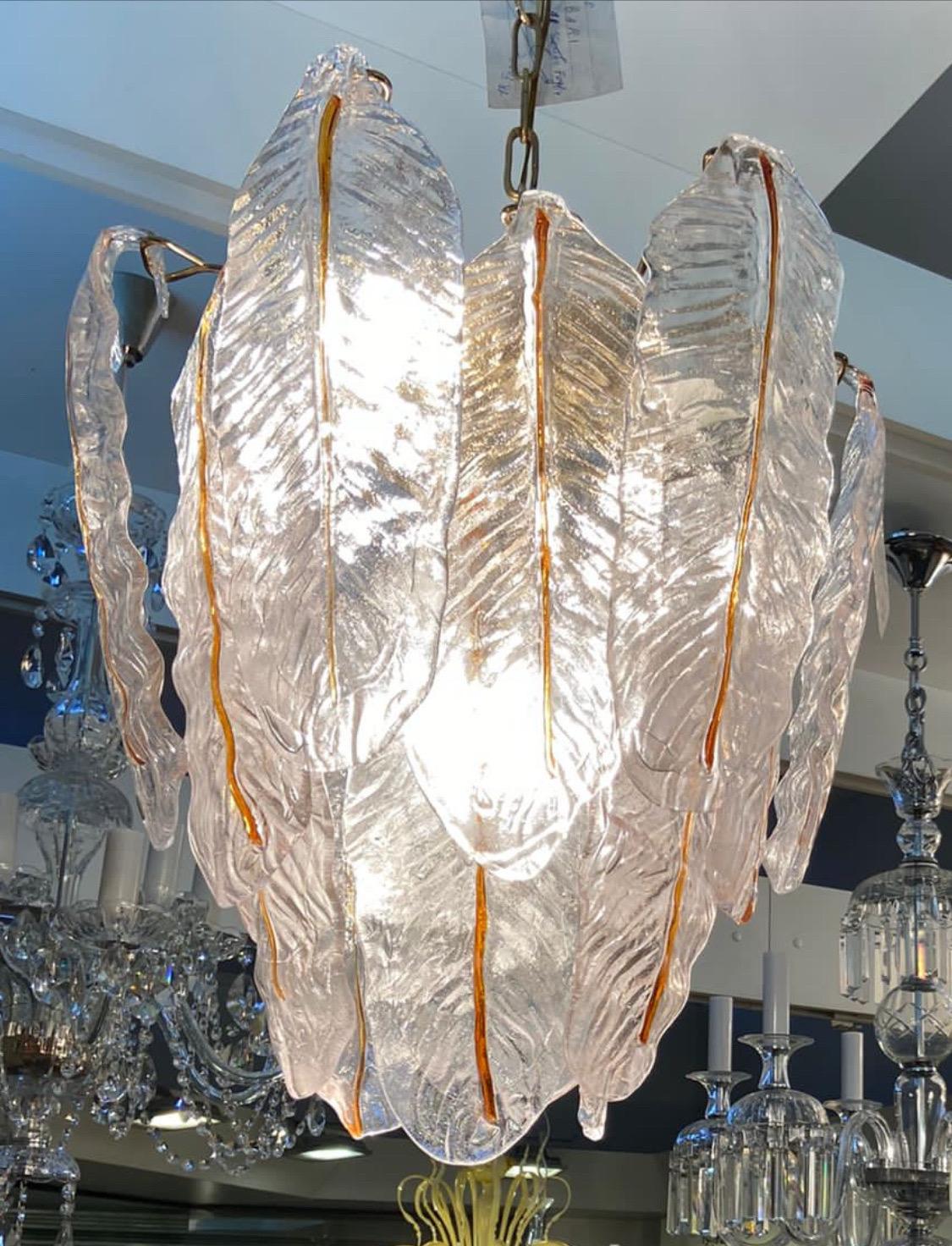 An amazing murano glass chandelier designed and manufactured in Venice in the seventies by Mazzega, the chandelier has in working order and in perfect conditions, it came from an important italian lighting shop going out of business and it'hasn't