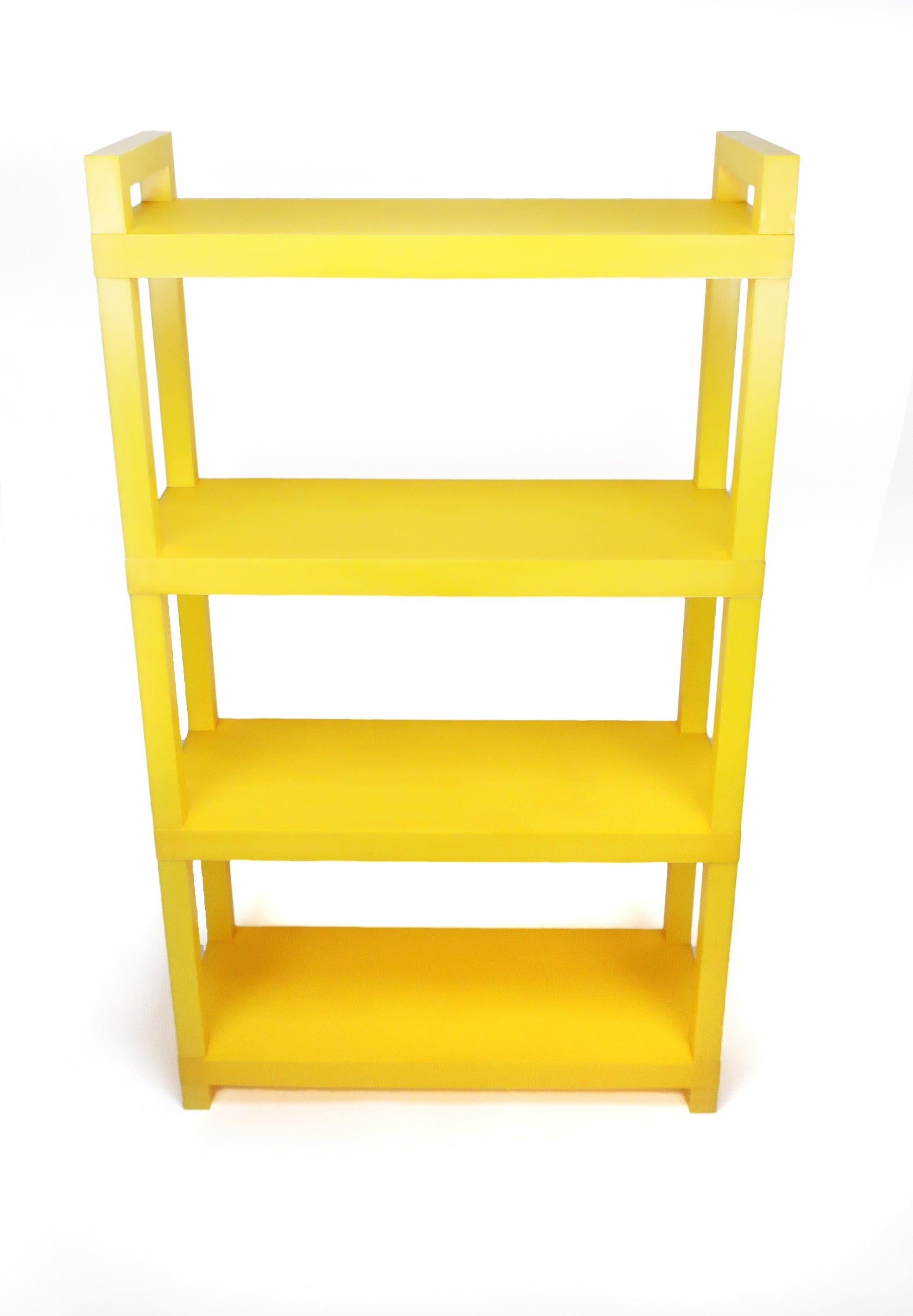A bright and sunny vintage yellow and white plastic shelving system in the style of Kartell and Umbo. It is modular and can be used as a wall unit, book shelf, or separated into low side tables. Interchangeability allows for shelves of all one color