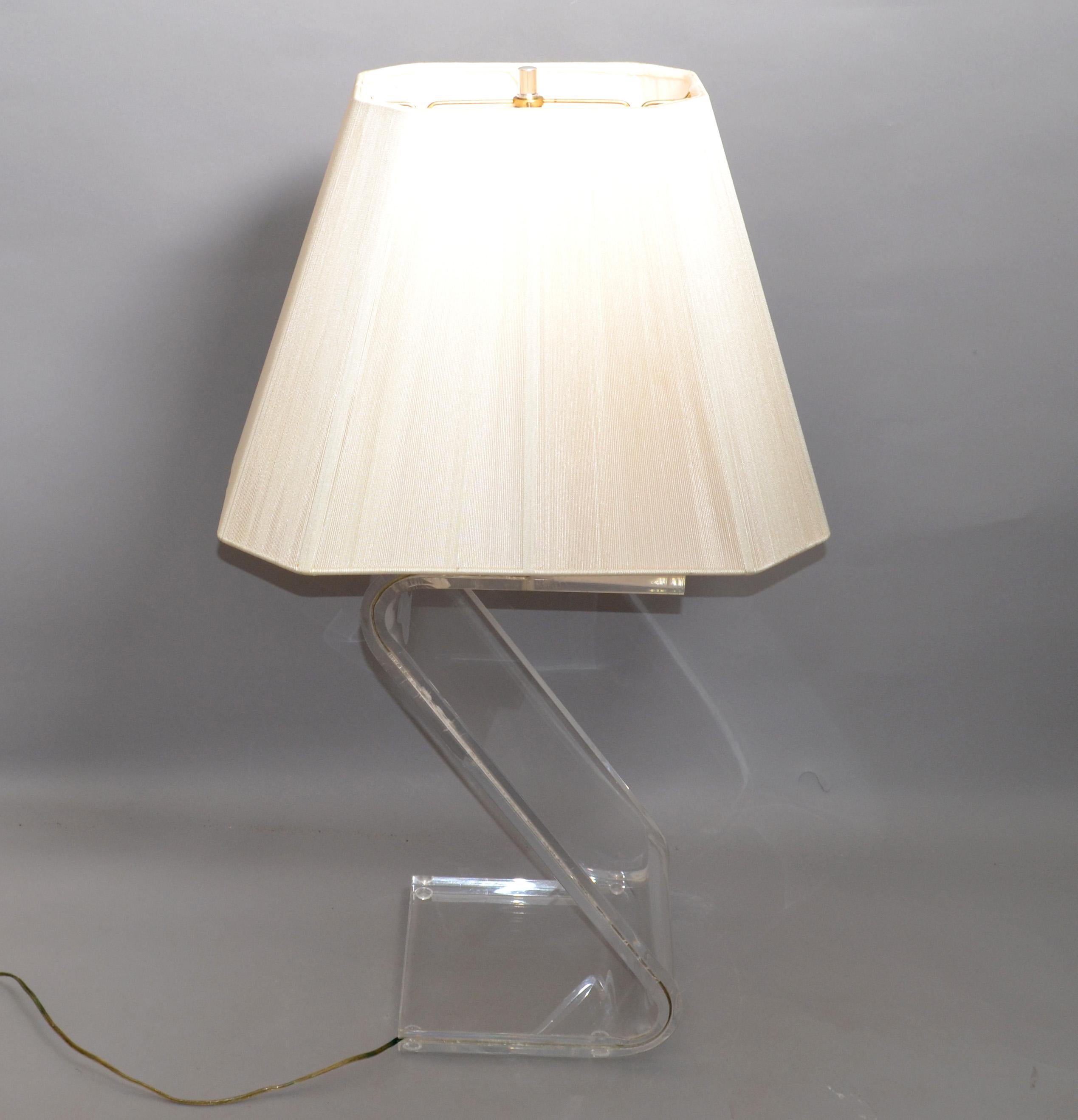 Stunning bent 1-inch-thick Lucite floor lamp in Z Shape with Chrome Hardware and a Beige Color Fabric Plissé Shade.
US Wiring and it takes one regular or LED Light bulb.
In pristine vintage condition with some age-related crazing to the