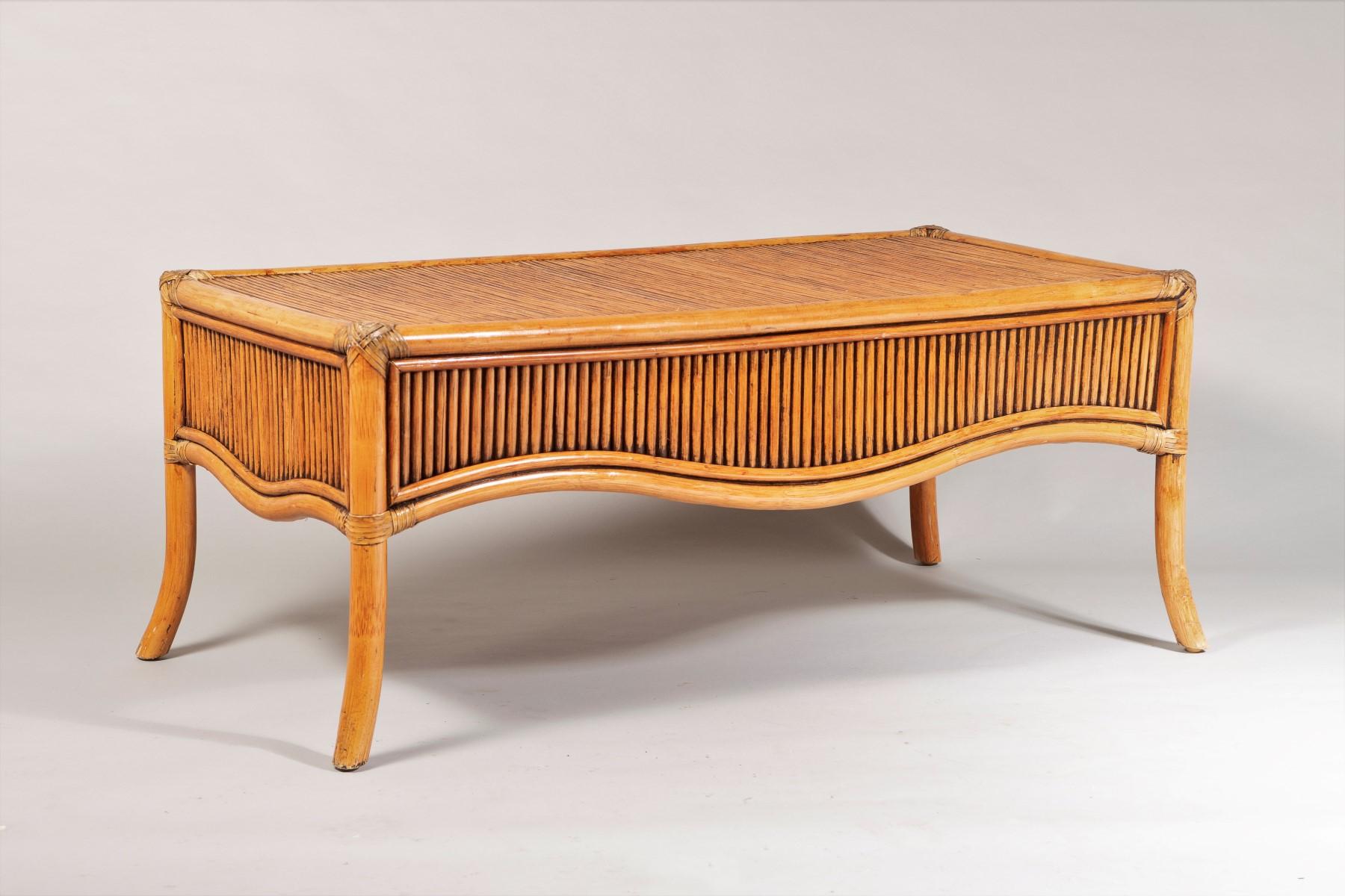 A stylish 1970s Mid Century Bamboo Coffee Table.  The bamboo is in a reeded style, very much in the manner of Vivai del Sud.  It has good form with lovely splayed legs and concaved apron, the bamboo has mellowed to a wonderful colour with dark and