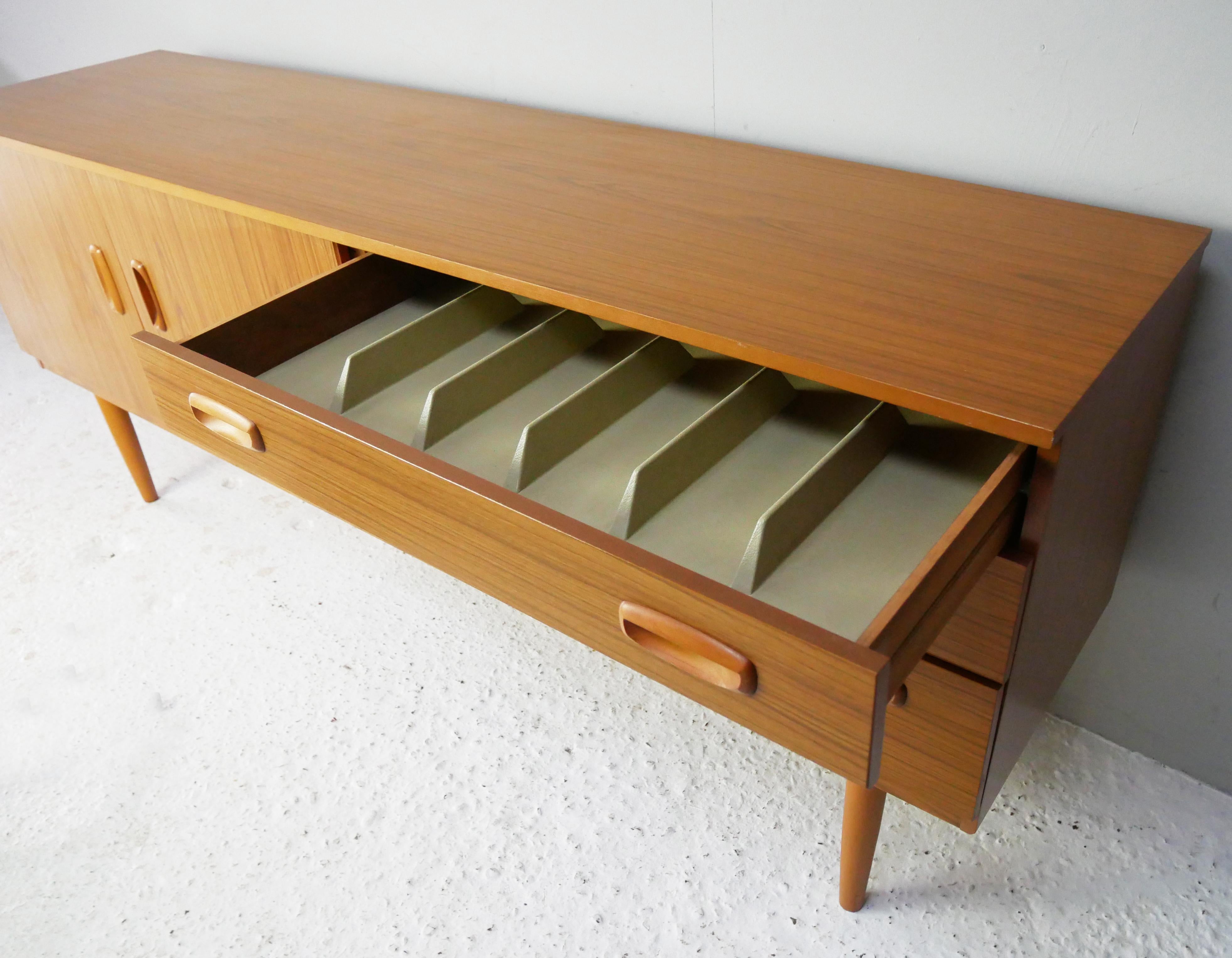 Schreiber was once a household name with shops all over the UK including Tottenham Court Road. The design philosophy was affordable well designed Scandinavian style. 

The furniture was finished in a distinctive Formica like veneer. 

This is an