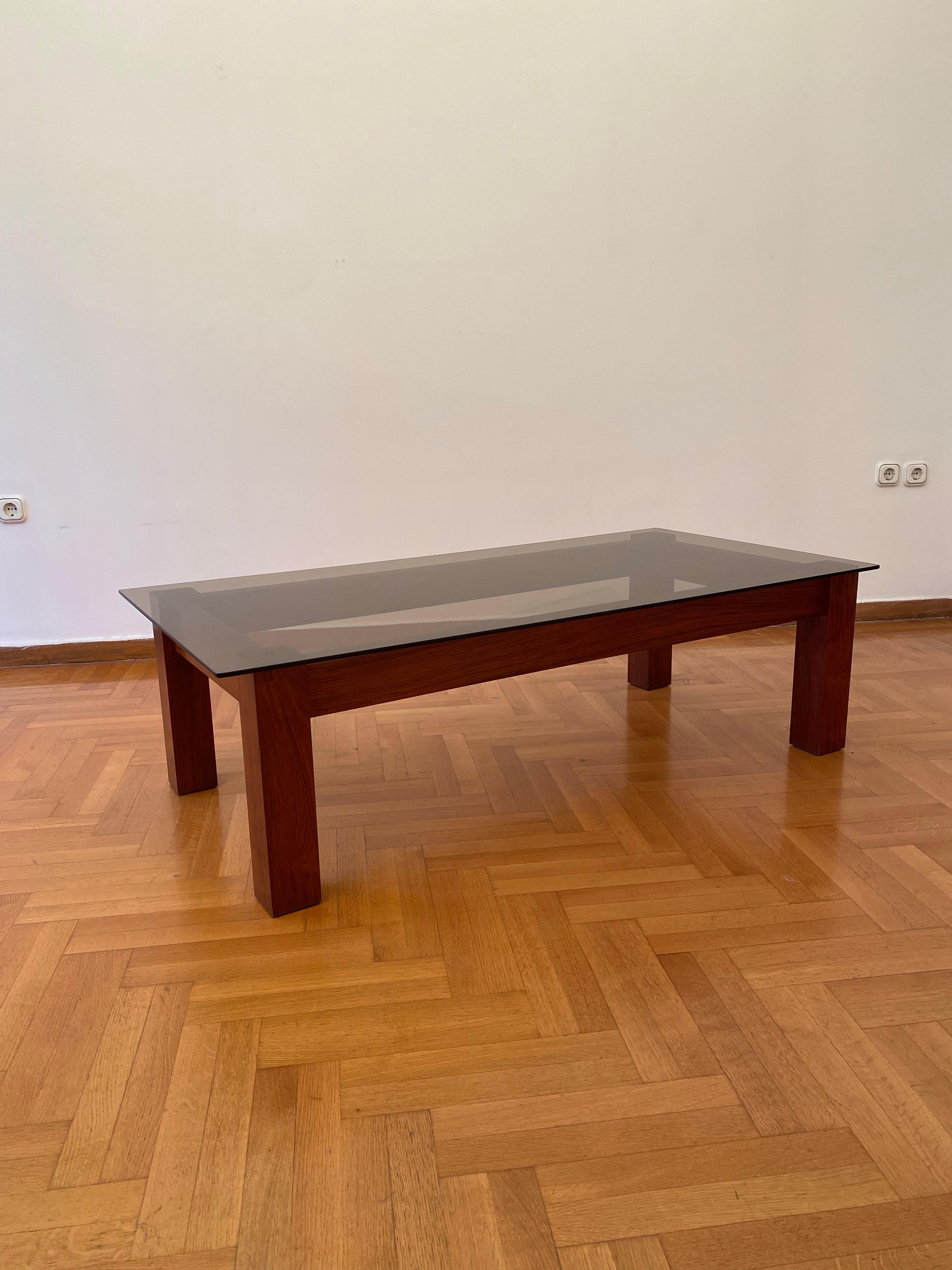 A simple but beautiful rectangular coffee table in its brutalist bold wooden frame and square smoked glass top. Simple craftsmanship with smooth wood finish.

Also available a side table. Please don’t hesitate to enquire about these pieces.

This