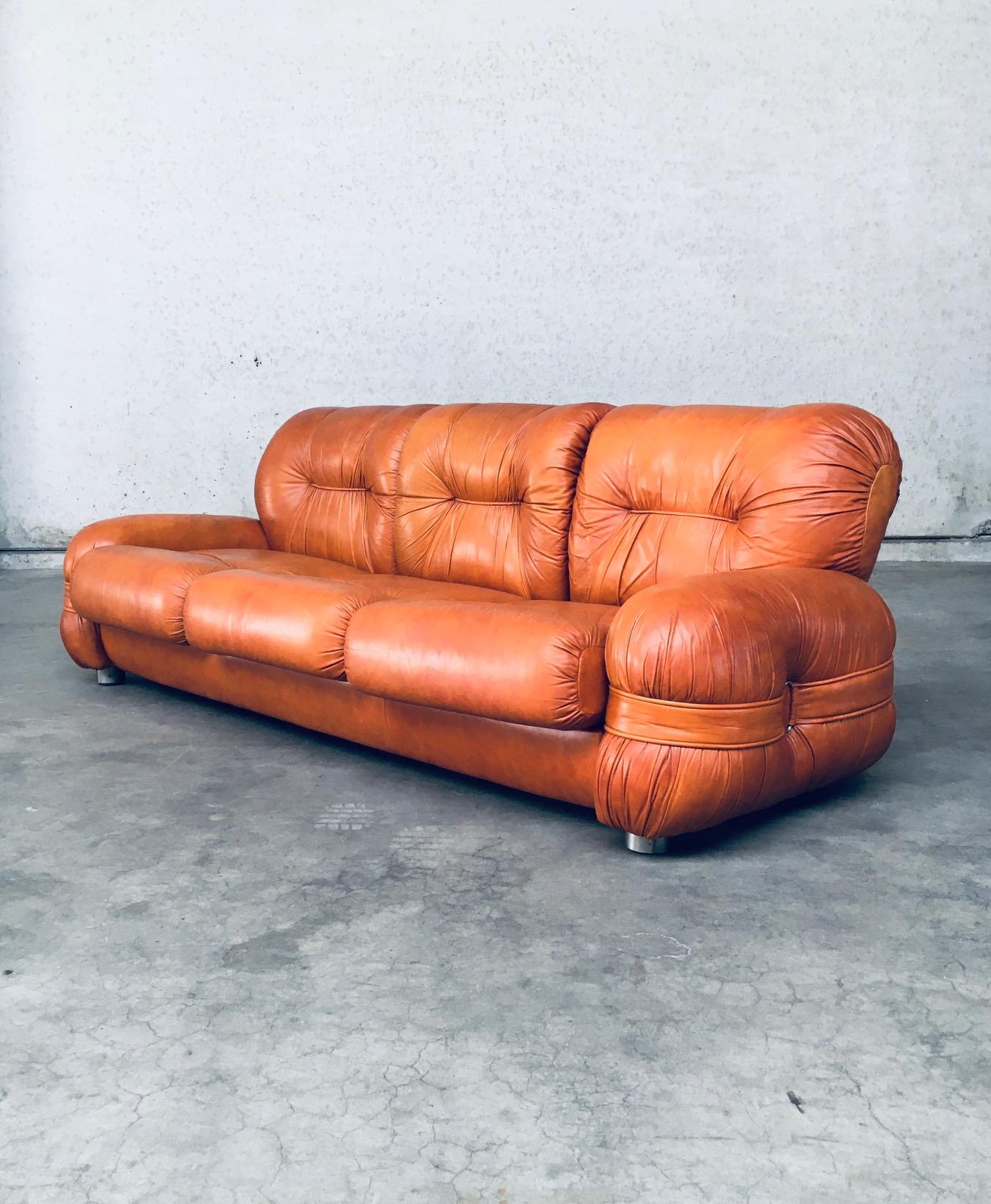 Vintage Midcentury Modern Italian Design Leather 3 Seat Sofa. Made in Italy, 1960's / 70's period. Cognac leather three seat sofa with straps and buckles on the side rests. Bulbous shapes on this very comfy and beautiful sofa. This comes in very